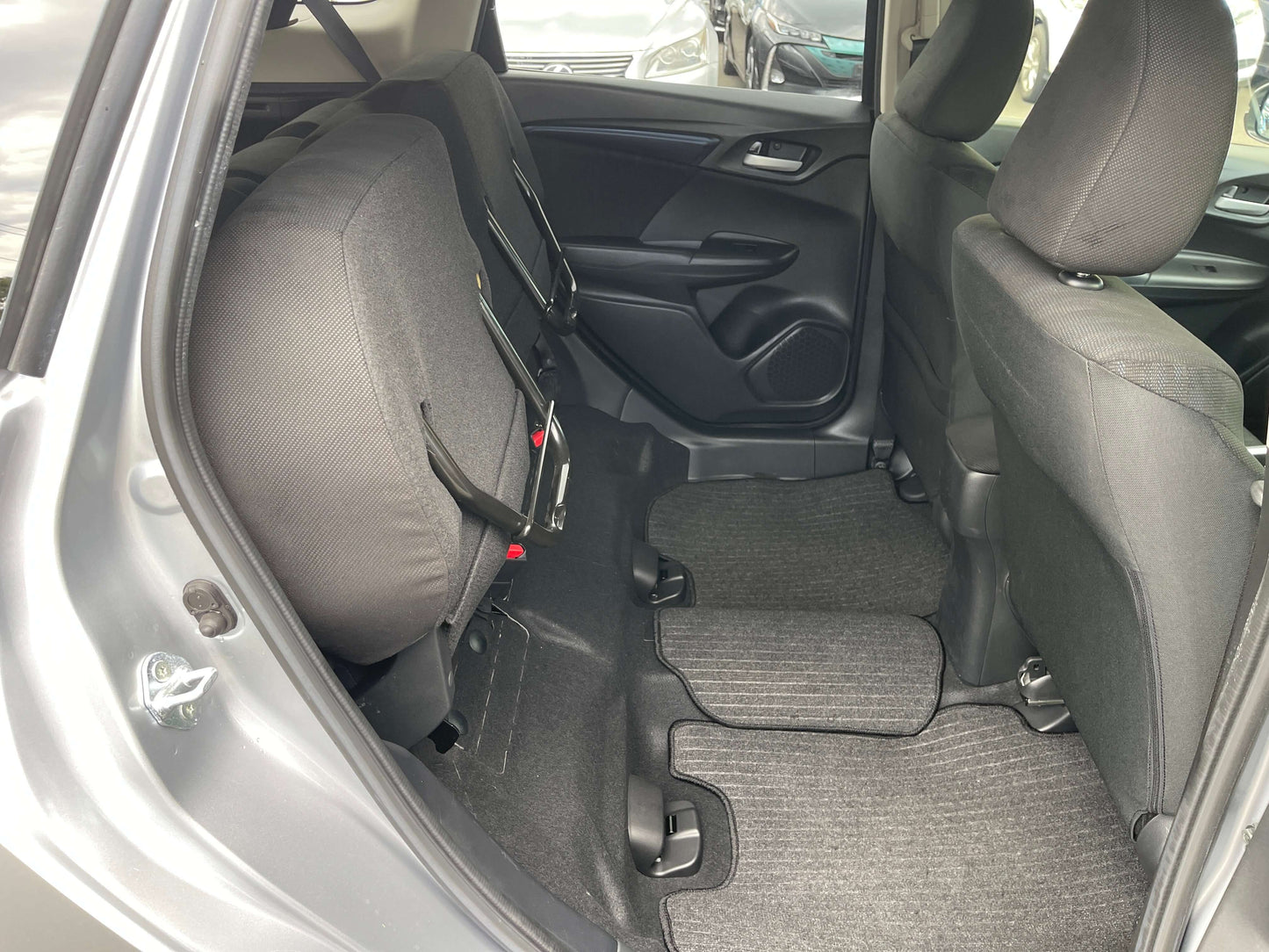 Back seat interior of a 2019 Honda Shuttle 1.5L 4WD Hybrid with spacious seating.
