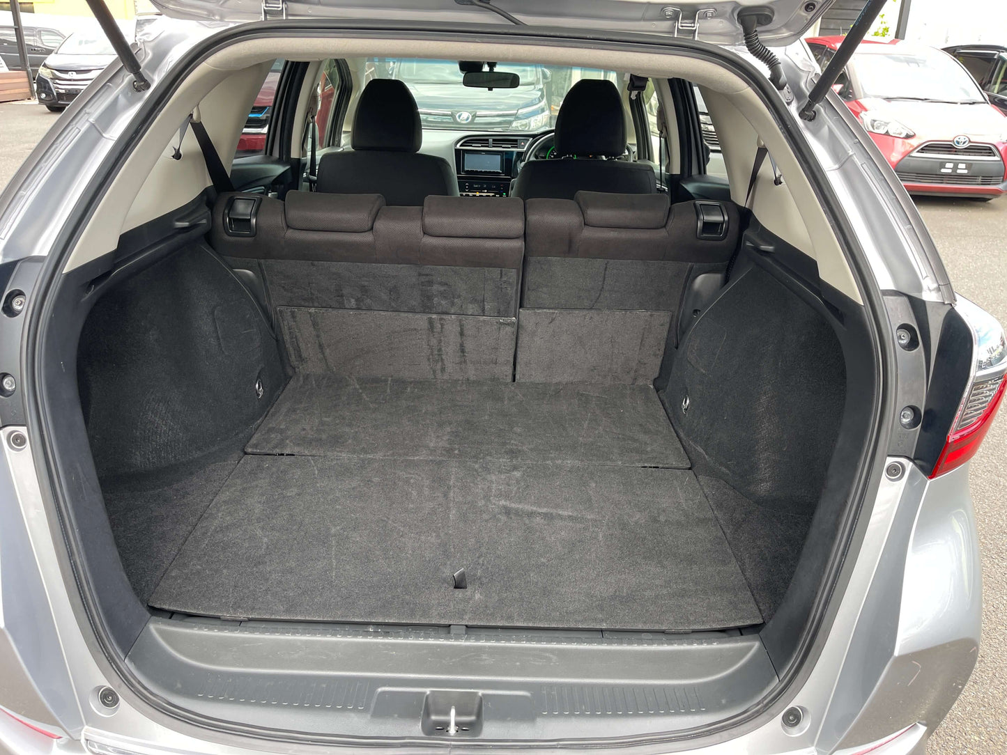 Interior view of the cargo space in a 2019 Honda Shuttle 1.5L 4WD Hybrid, showcasing ample storage capacity.