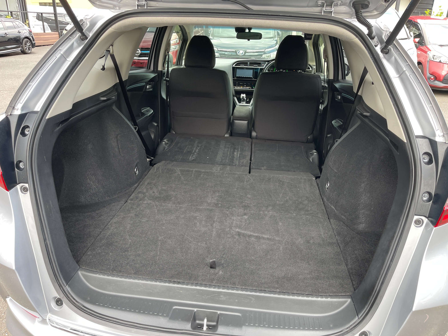 Interior view of 2019 Honda Shuttle 1.5L 4WD Hybrid X Honda Sensing Edition trunk space with seats down.