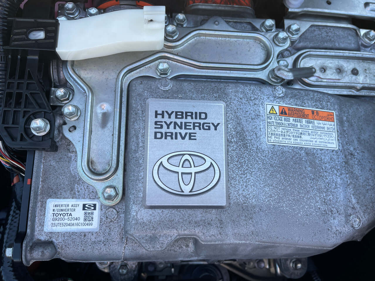 2016 Toyota Sienta 1.5L Hybrid Close-up of the Hybrid Synergy Drive engine component in a 2016 Toyota Sienta 1.5L Hybrid.