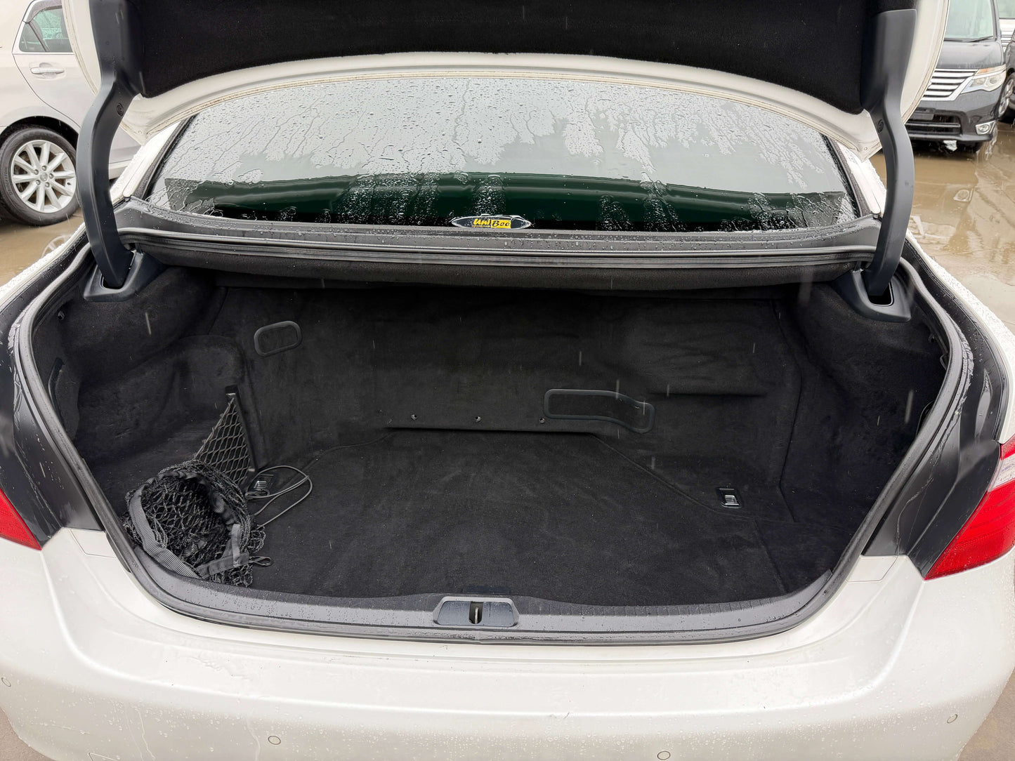 2007 Lexus LS600h AWD V8 5.0L Hybrid trunk view showcasing spacious interior for luggage.