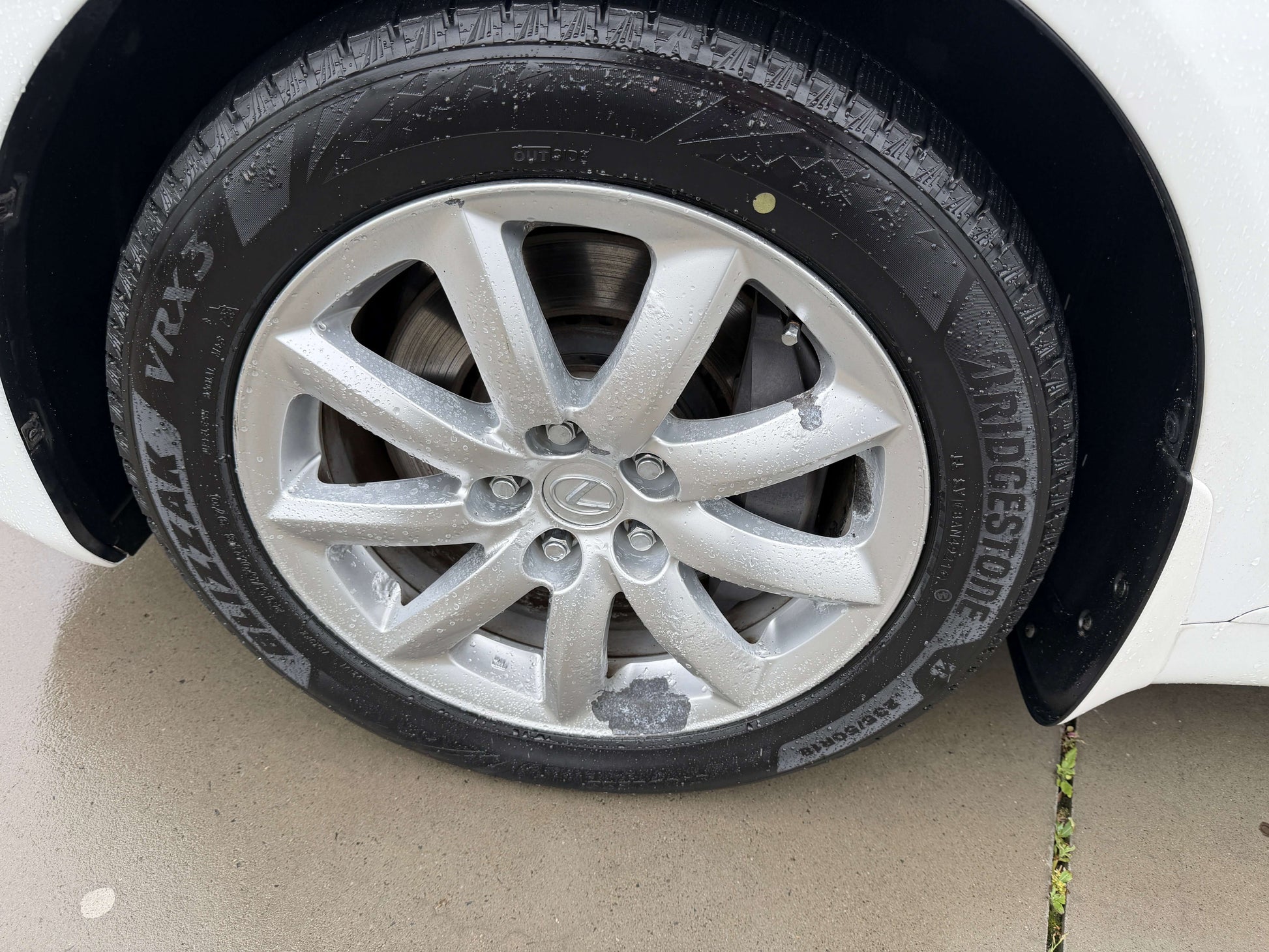 2007 Lexus LS600h AWD V8 5.0L Hybrid sedan wheel and tire close-up, featuring Bridgestone Potenza tires.