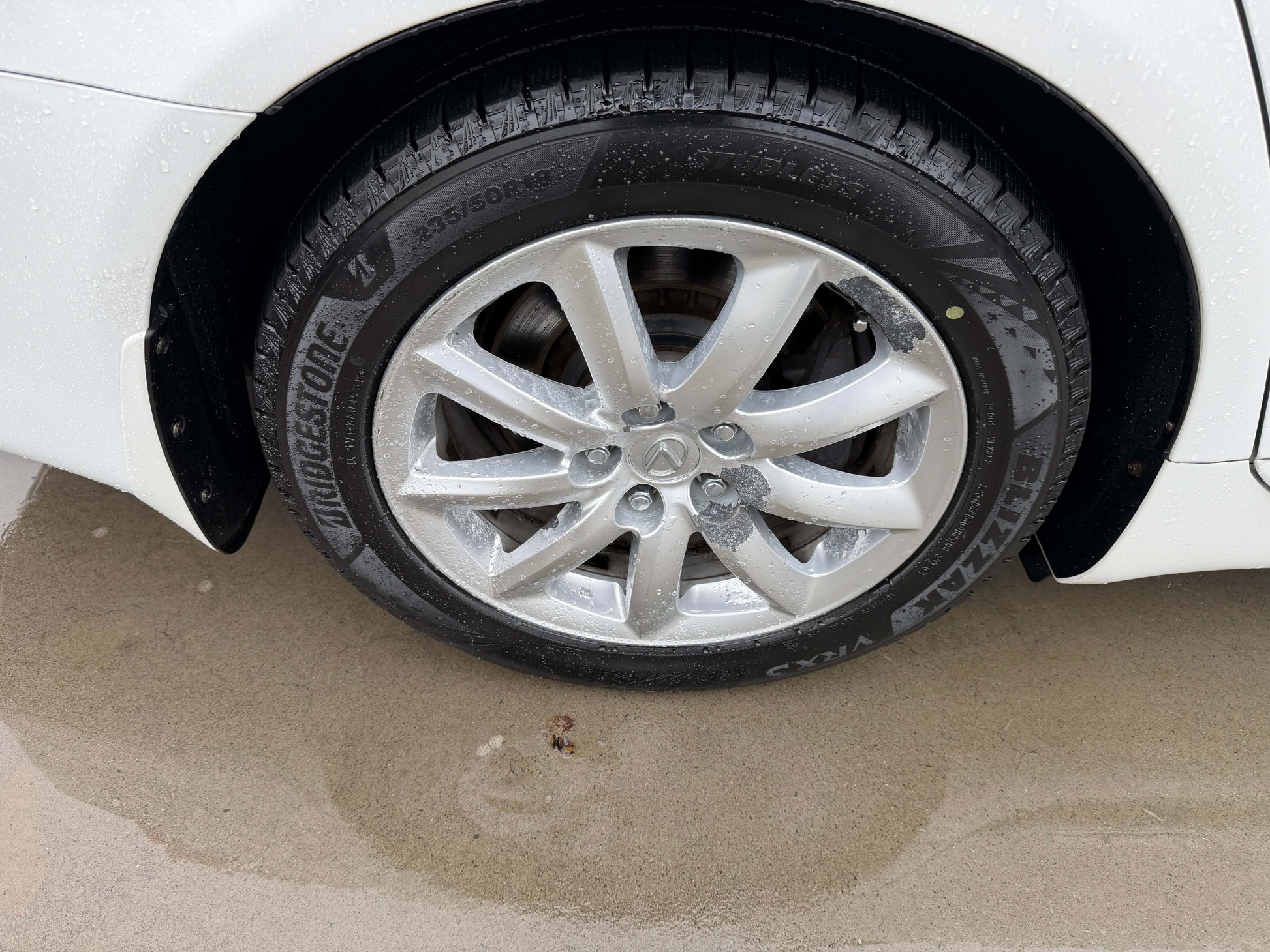 2007 Lexus LS600h AWD V8 5.0L Hybrid luxury sedan wheel detail with Bridgestone tires.