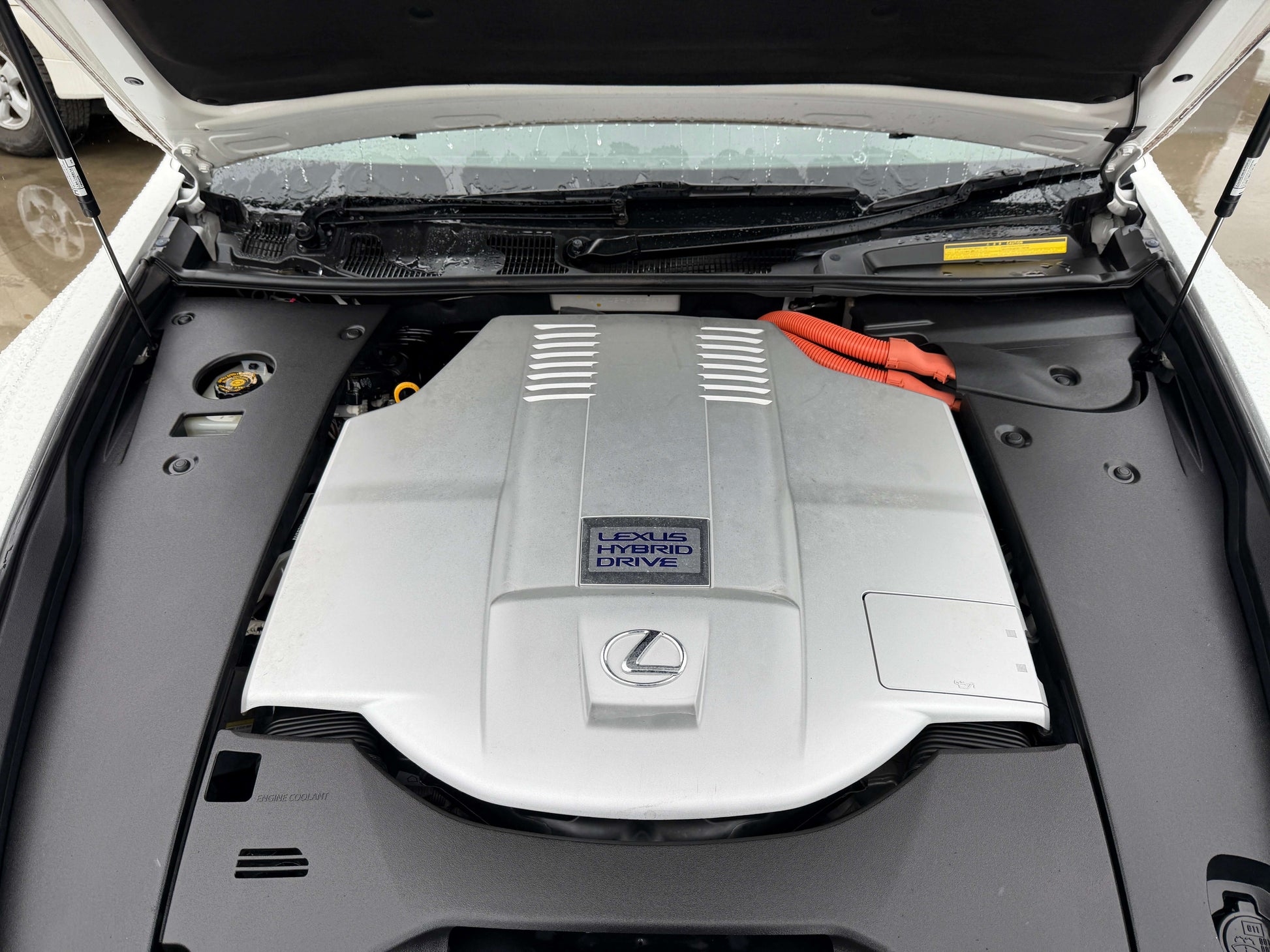 Engine compartment of 2007 Lexus LS600h AWD V8 5.0L Hybrid showing hybrid drive components.