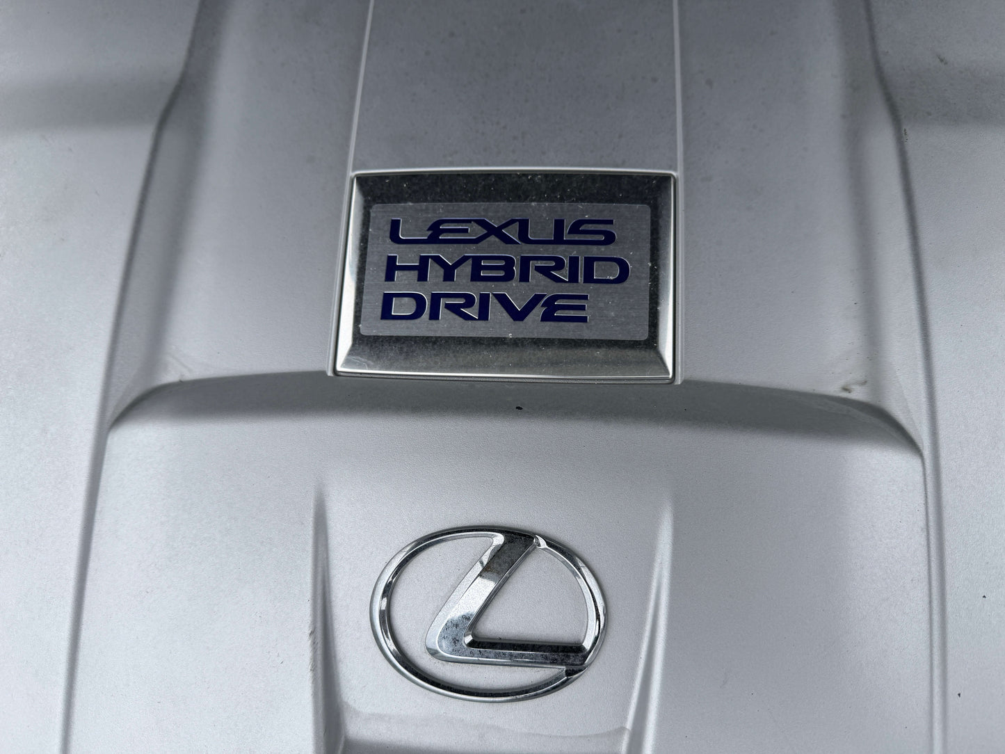 2007 Lexus LS600h AWD V8 5.0L Hybrid emblem showcasing Lexus Hybrid Drive.