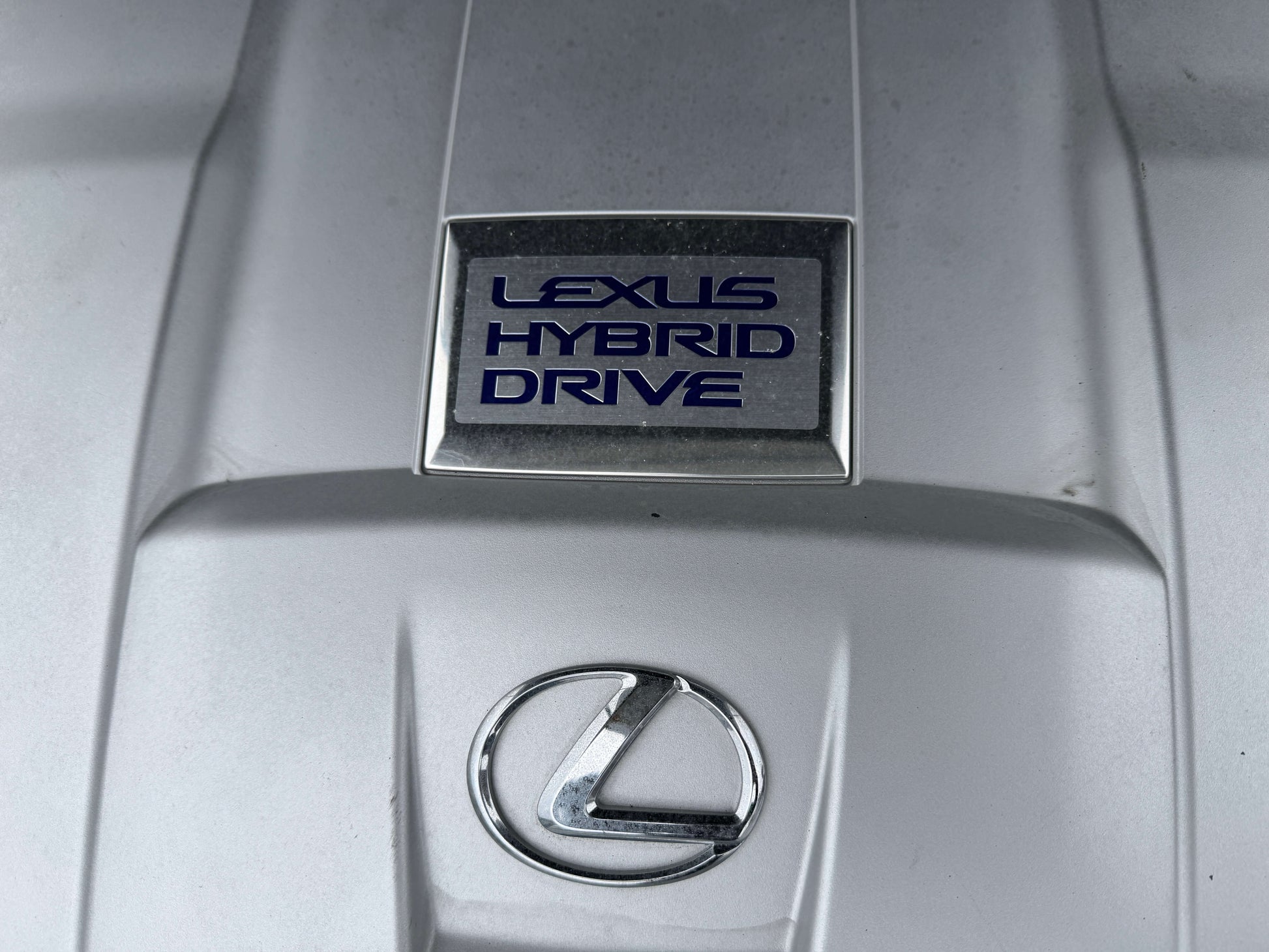 2007 Lexus LS600h AWD V8 5.0L Hybrid emblem showcasing Lexus Hybrid Drive.