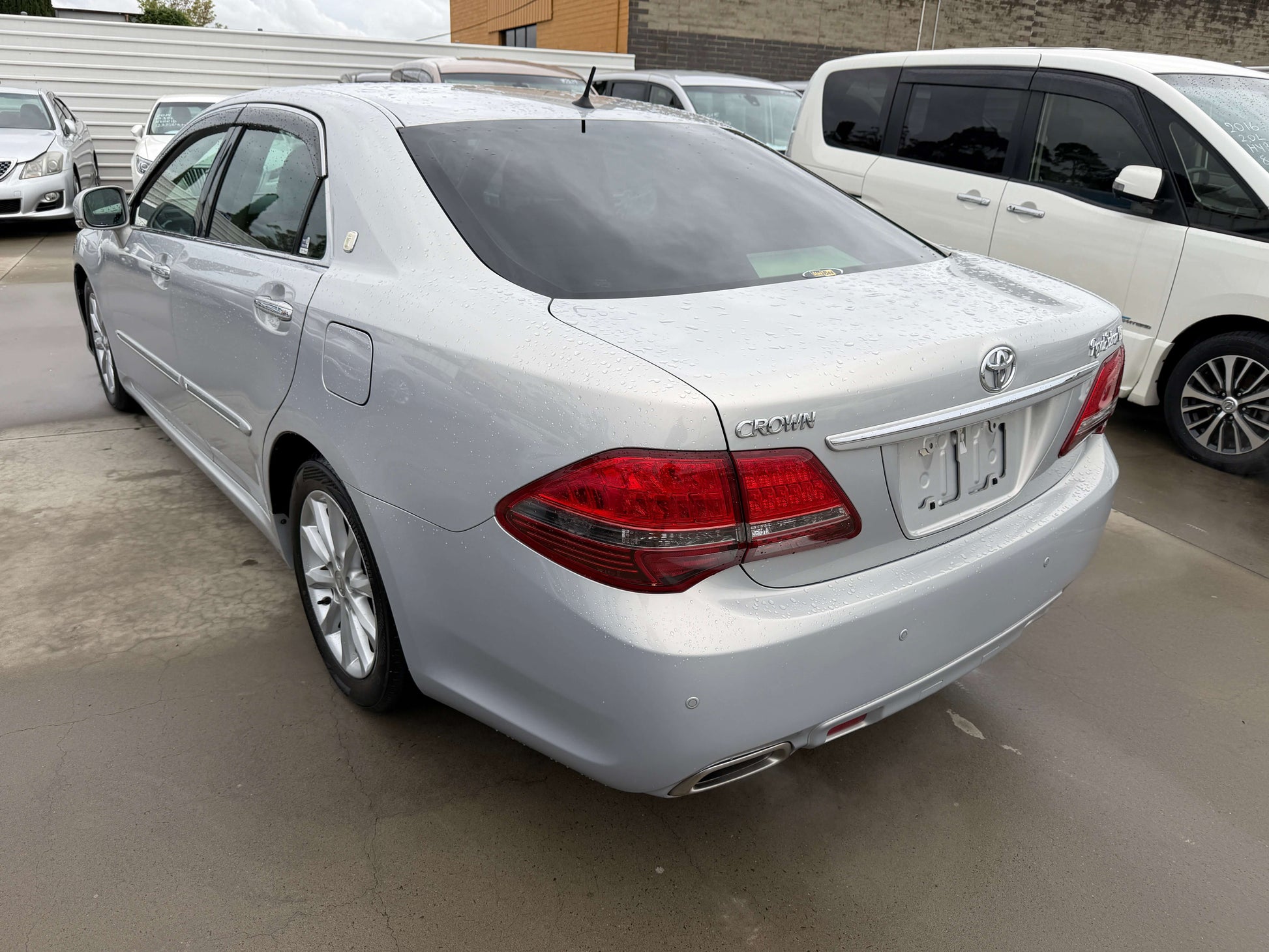 2008 Toyota Crown V6 3.0L Royal Saloon G-Edition Luxury Sedan rear view in silver color, showcasing design and features.