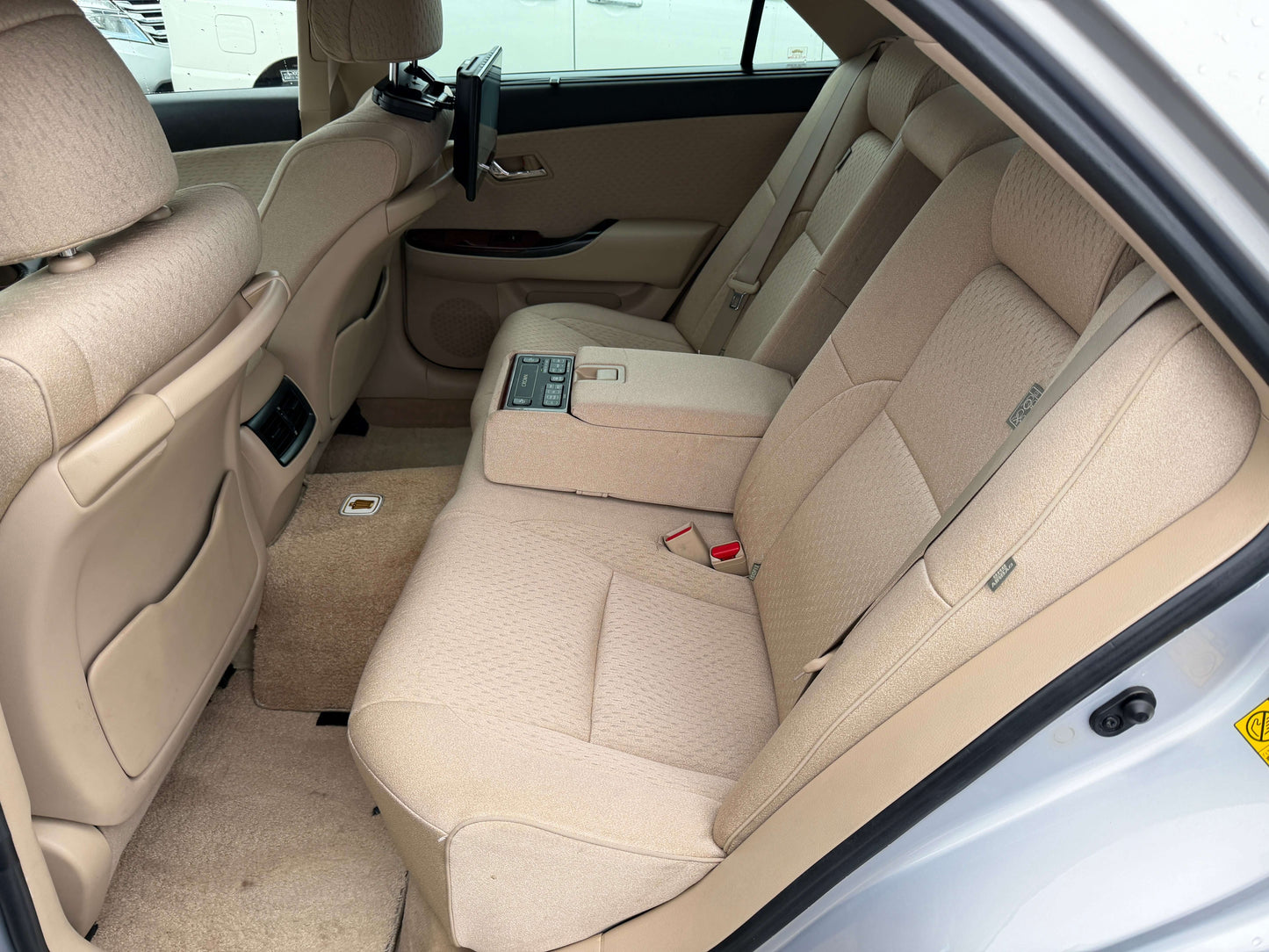 Interior view of the spacious rear seating area in a 2008 Toyota Crown V6 3.0L Royal Saloon Luxury Sedan.