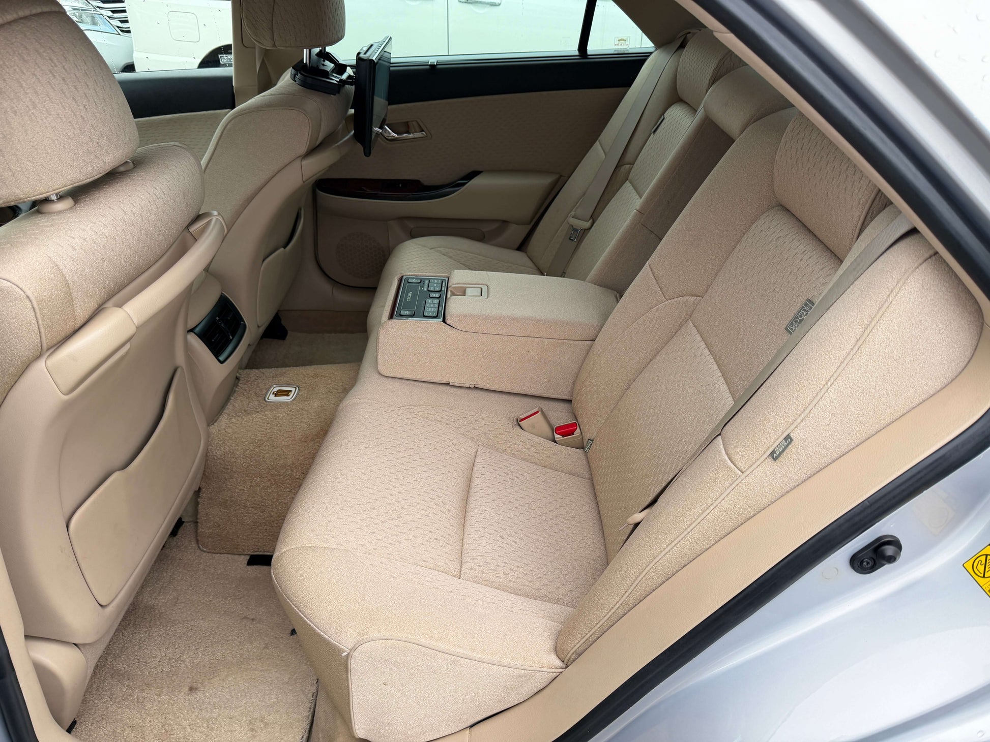 Interior view of the spacious rear seating area in a 2008 Toyota Crown V6 3.0L Royal Saloon Luxury Sedan.