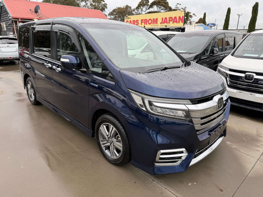2018 Honda Honda Stepwgn 2.0 Spada Hybrid G parked at a dealership, showcasing its sleek design and hybrid features.