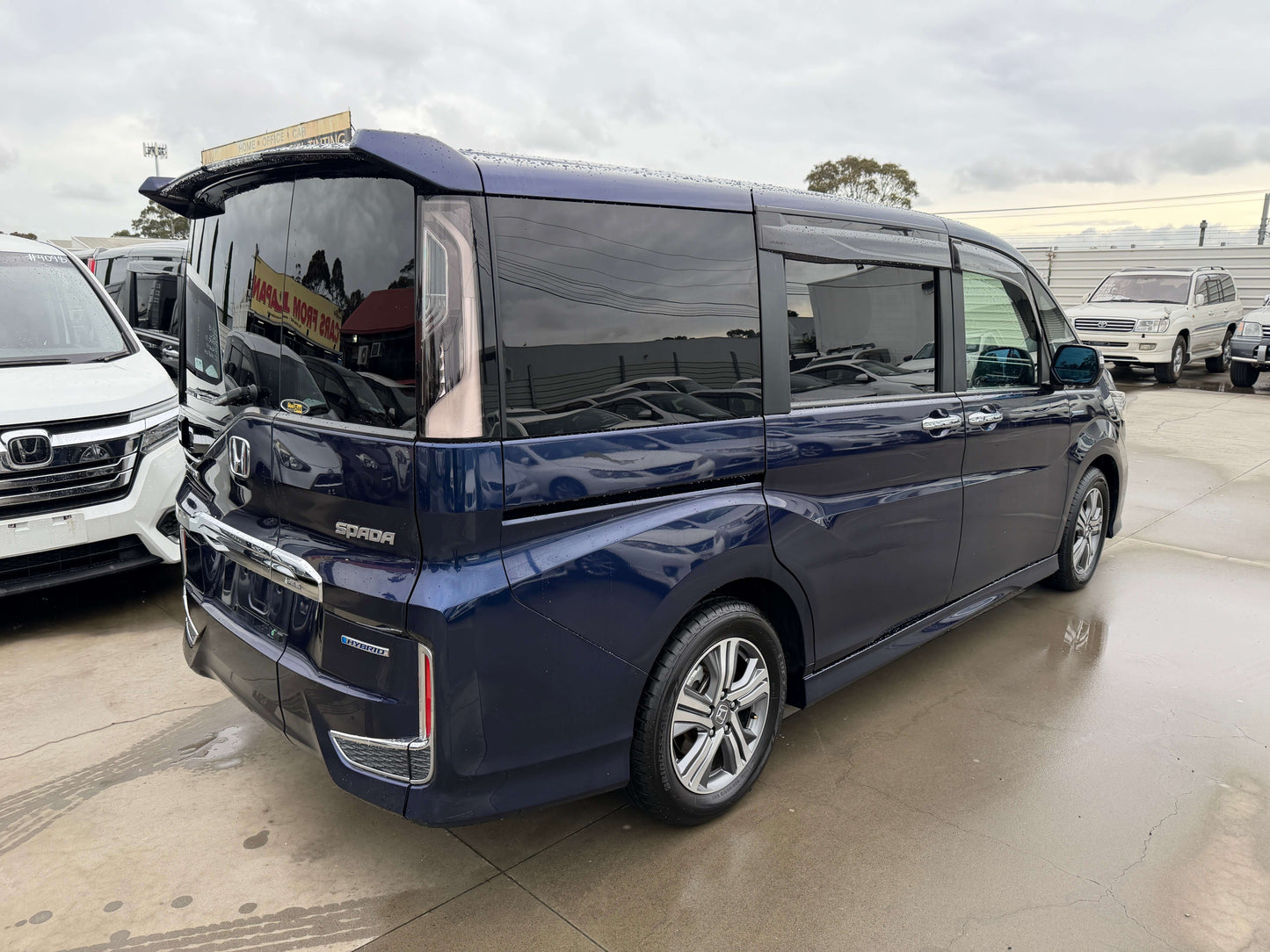 2018 Honda Honda Stepwgn 2.0 Spada Hybrid G parked at a dealership, showcasing its sleek design and modern features.