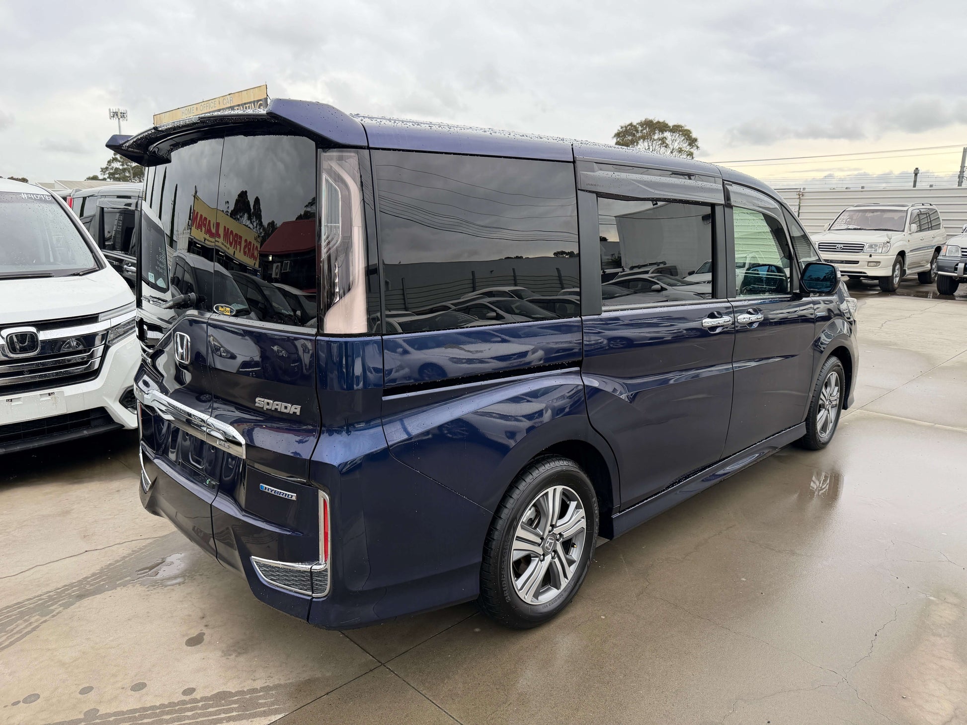 2018 Honda Honda Stepwgn 2.0 Spada Hybrid G parked at a dealership, showcasing its sleek design and modern features.