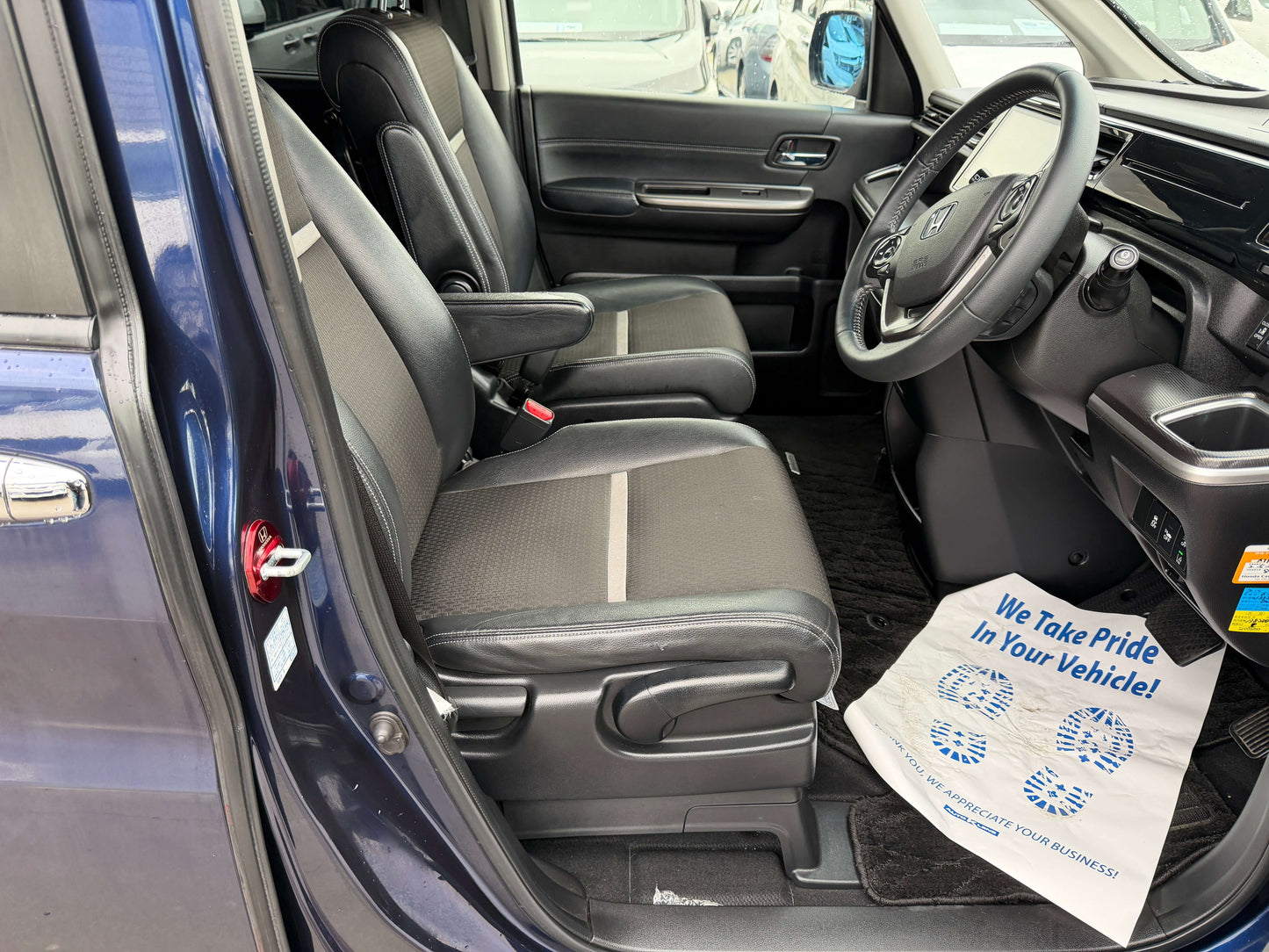Interior view of the 2018 Honda Honda Stepwgn 2.0 Spada Hybrid with spacious seating and modern dashboard features.