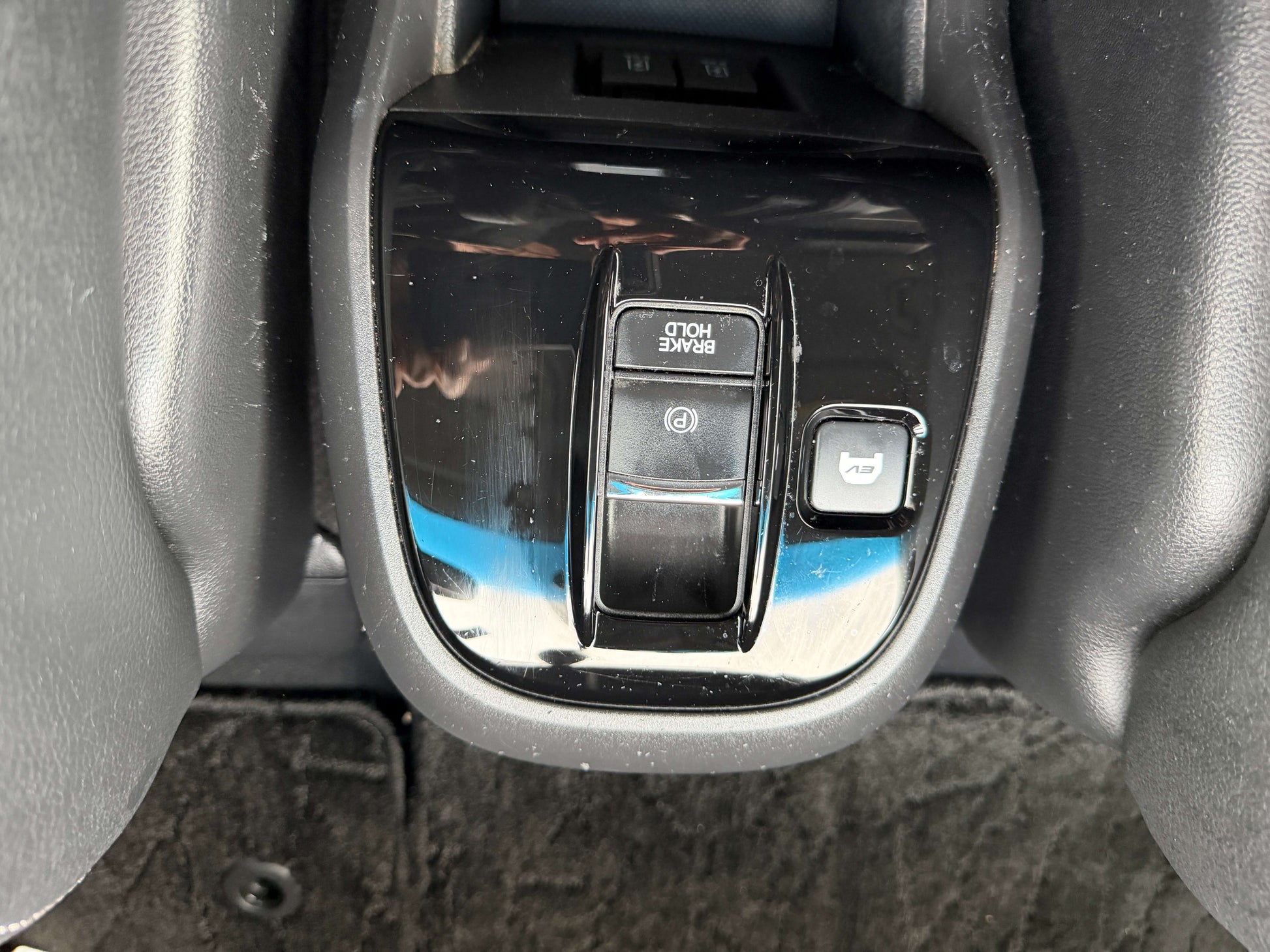 2018 Honda Honda Stepwgn 2.0 Spada Hybrid interior button controls including brake hold and parking brake.