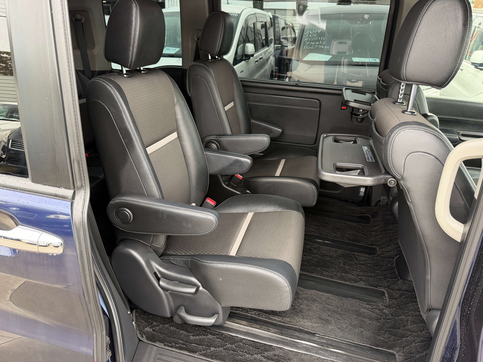 Interior view of the 2018 Honda Honda Stepwgn 2.0 Spada Hybrid G with spacious seating for 7, highlighting comfortable front seats.