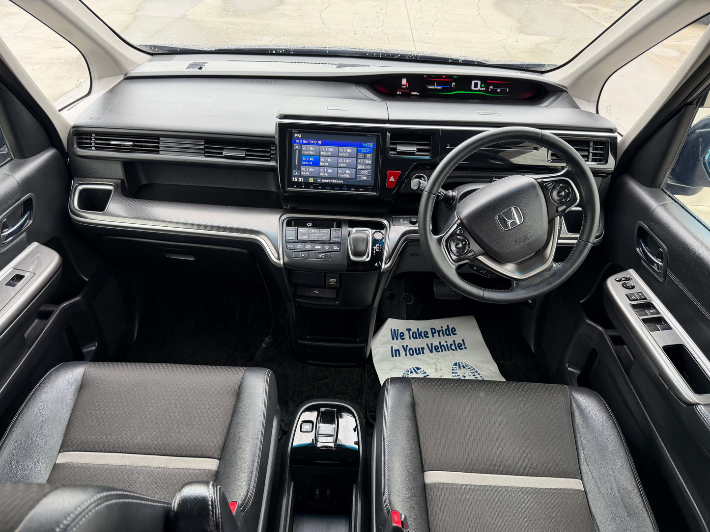 Interior view of 2018 Honda Honda Stepwgn 2.0 Spada Hybrid G with spacious seating and modern dashboard features.
