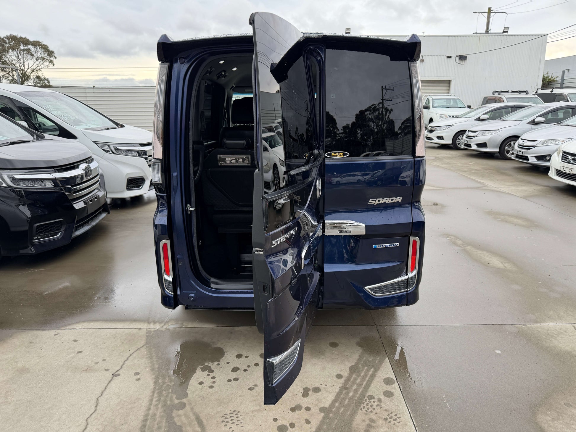 2018 Honda Honda Stepwgn 2.0 Spada Hybrid with open rear doors showcasing spacious interior.