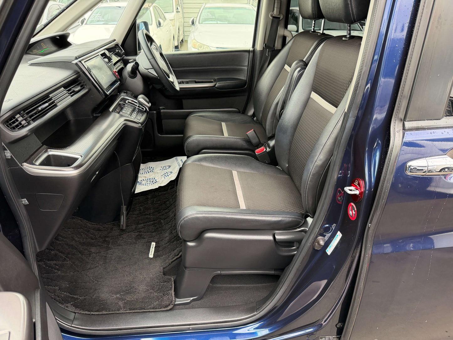 Interior view of the spacious seating in a 2018 Honda Honda Stepwgn 2.0 Spada Hybrid, showcasing a 7-seater configuration.