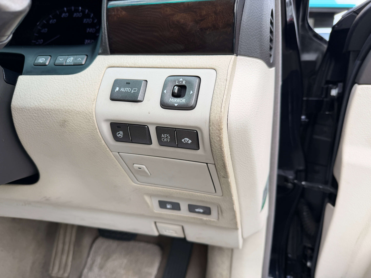 Interior controls of a 2007 Lexus LS600h AWD V8 5.0L Hybrid luxury sedan showcasing features and buttons.