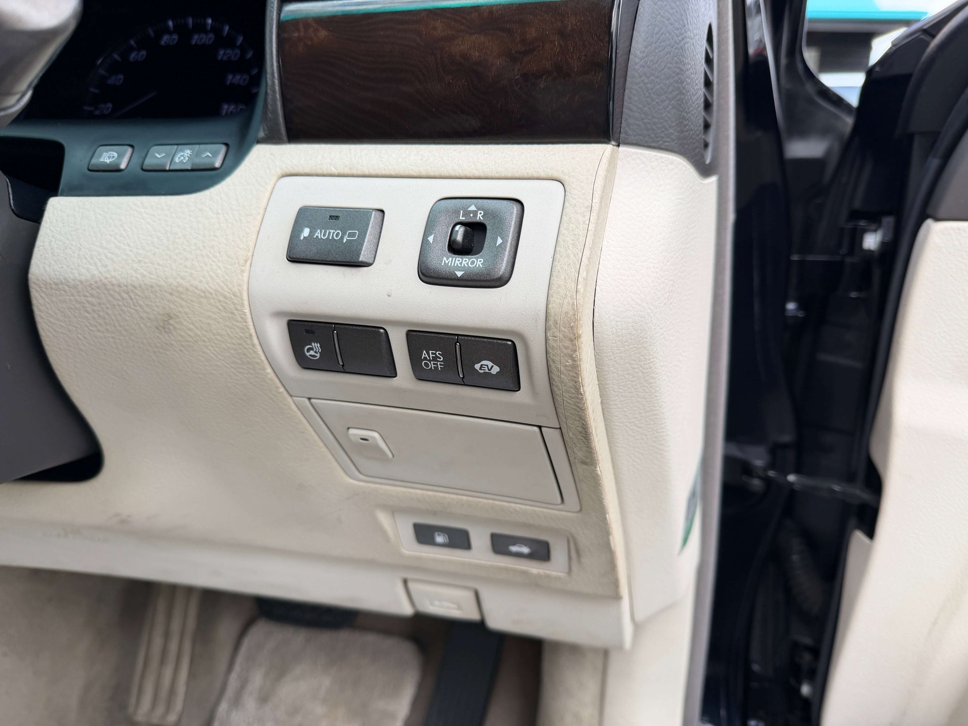 Interior controls of a 2007 Lexus LS600h AWD V8 5.0L Hybrid luxury sedan showcasing features and buttons.