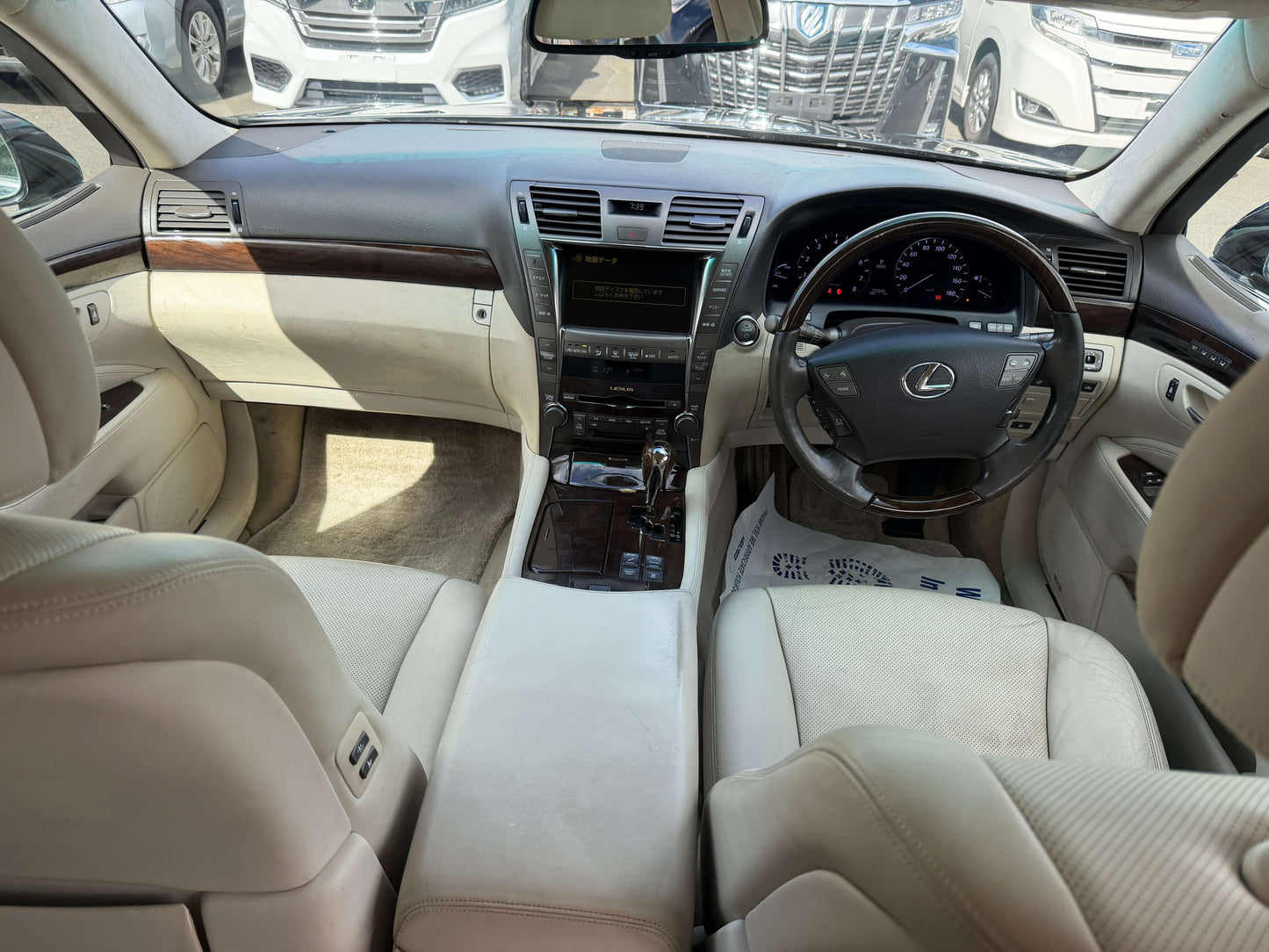 Interior view of 2007 Lexus LS600h AWD V8 5.0L Hybrid with luxury seating and dashboard details.