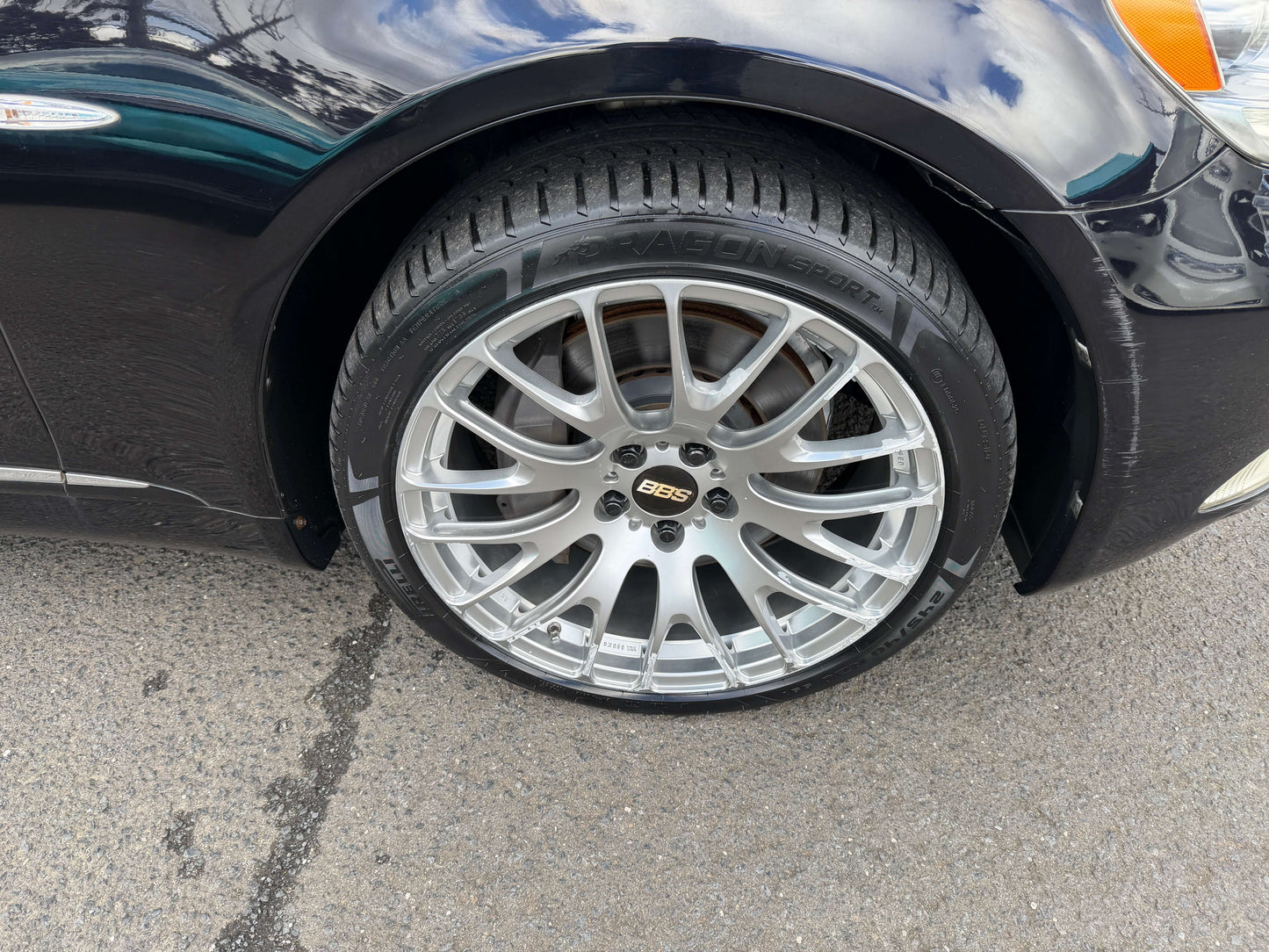 Close-up of 2007 Lexus LS600h AWD V8 5.0L Hybrid luxury sedan wheel and tire showcasing precision design.