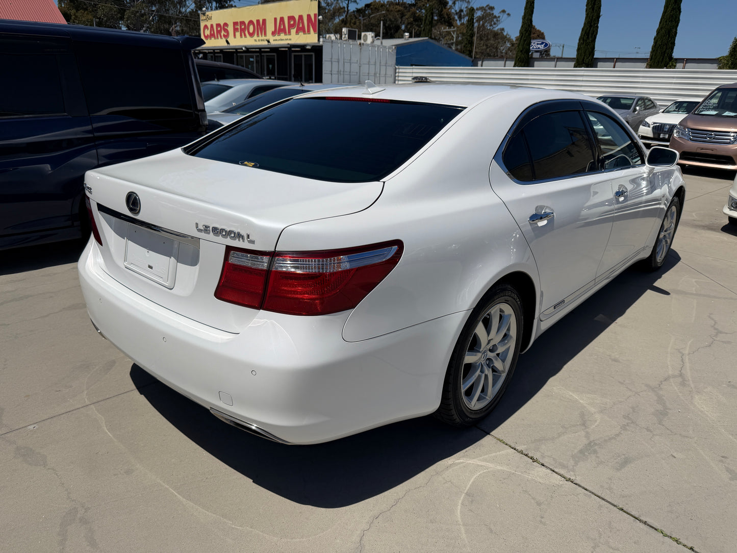 2007 Lexus LS600hL AWD V8 5.0L Hybrid Luxury Sedan rear view with white paint and sleek design