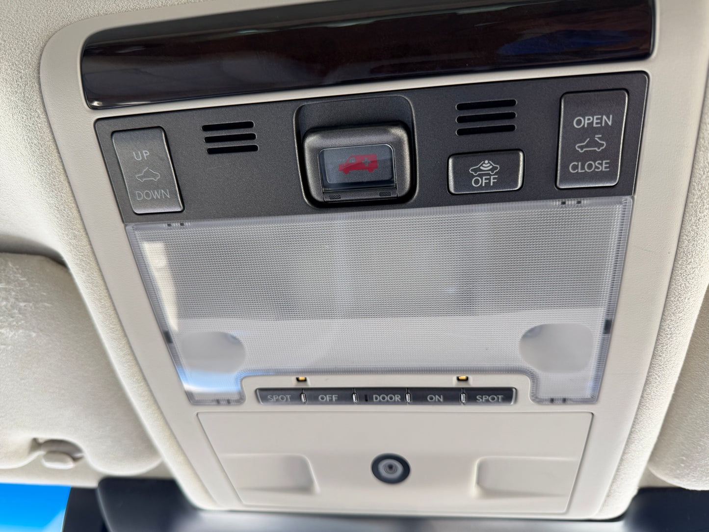 2007 Lexus LS600hL AWD V8 5.0L Hybrid Interior ceiling controls for sunroof and lights of a luxury vehicle, showcasing buttons for open, close and settings.