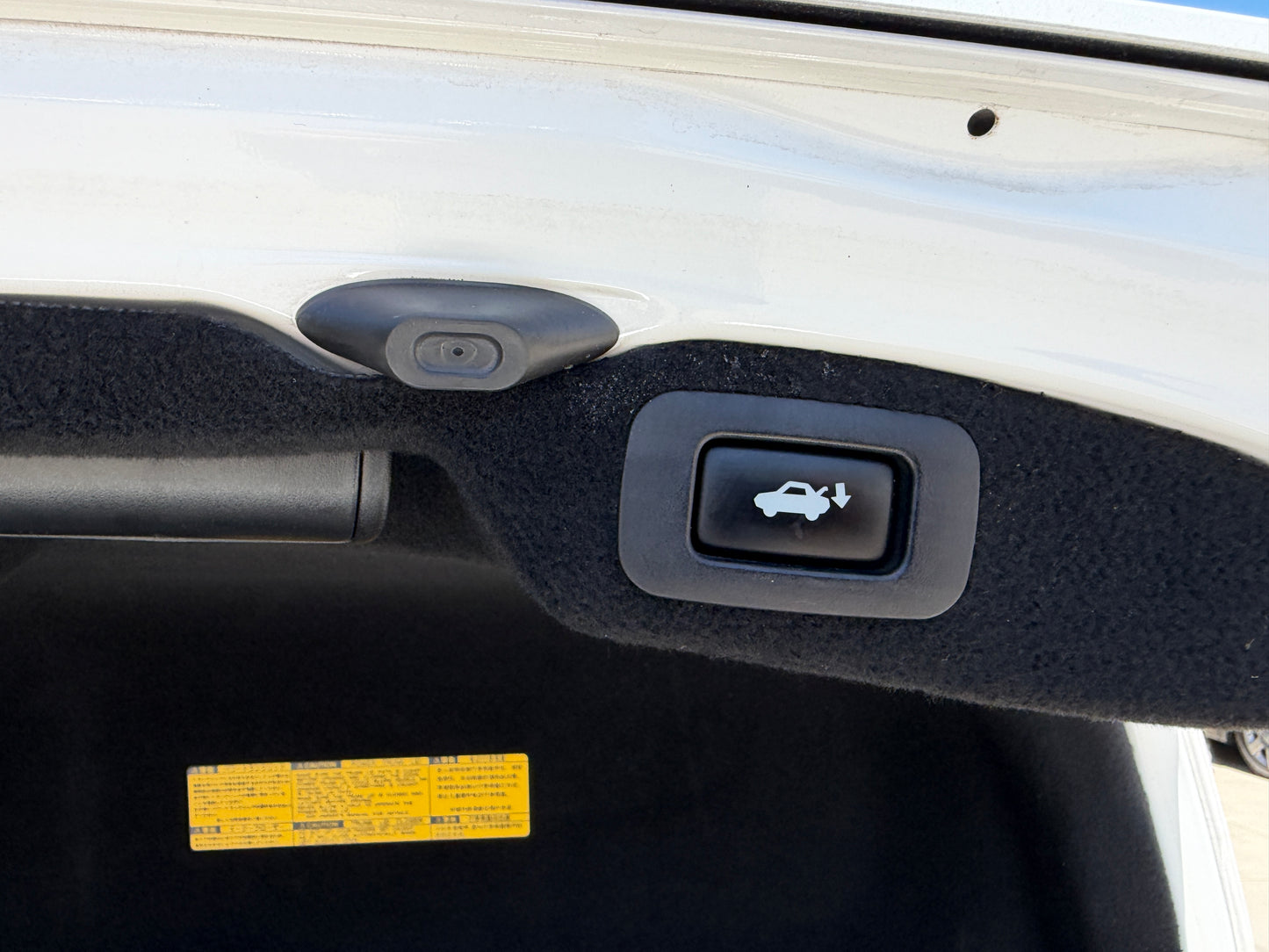 Close-up of the trunk release button and interior features of a 2007 Lexus LS600hL AWD V8 5.0L Hybrid luxury sedan.