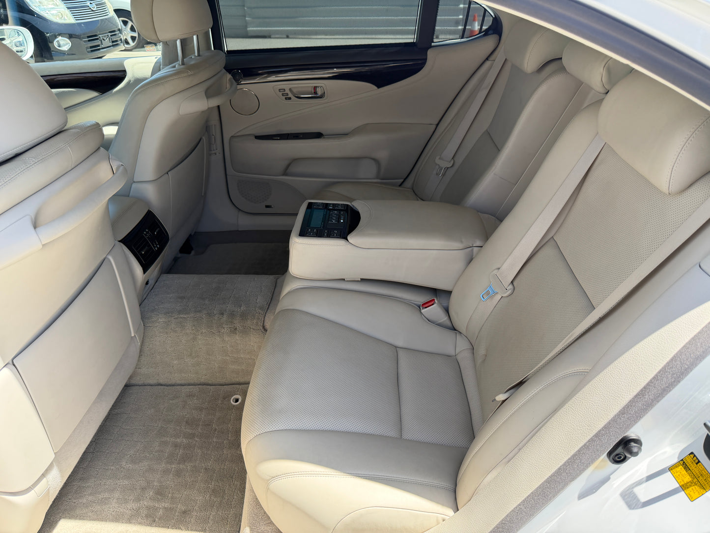Rear interior view of a 2007 Lexus LS600hL AWD V8 5.0L Hybrid luxury sedan showcasing plush seating.
