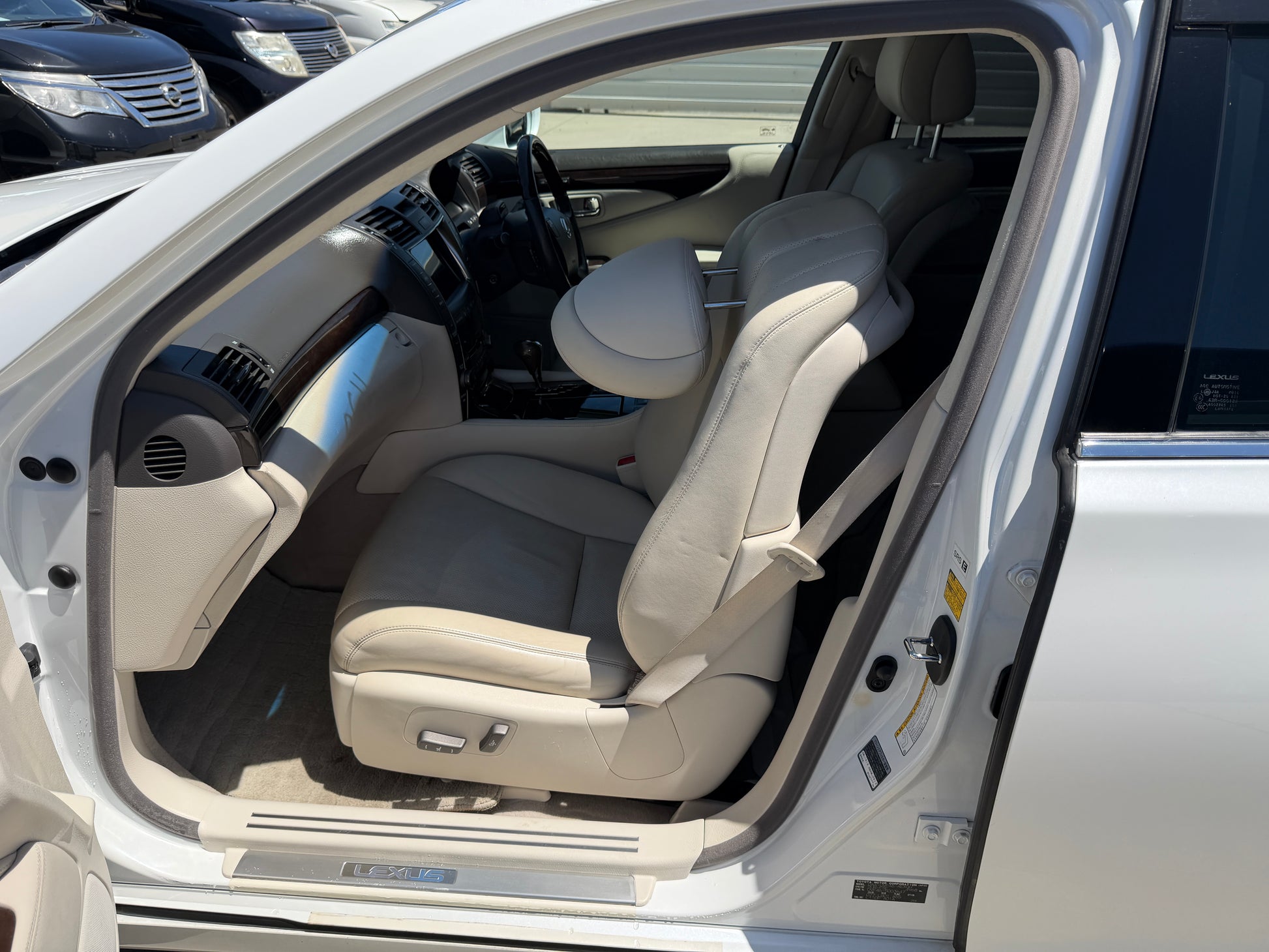 Interior view of a 2007 Lexus LS600hL AWD V8 5.0L Hybrid luxury sedan showing comfortable beige front seats.