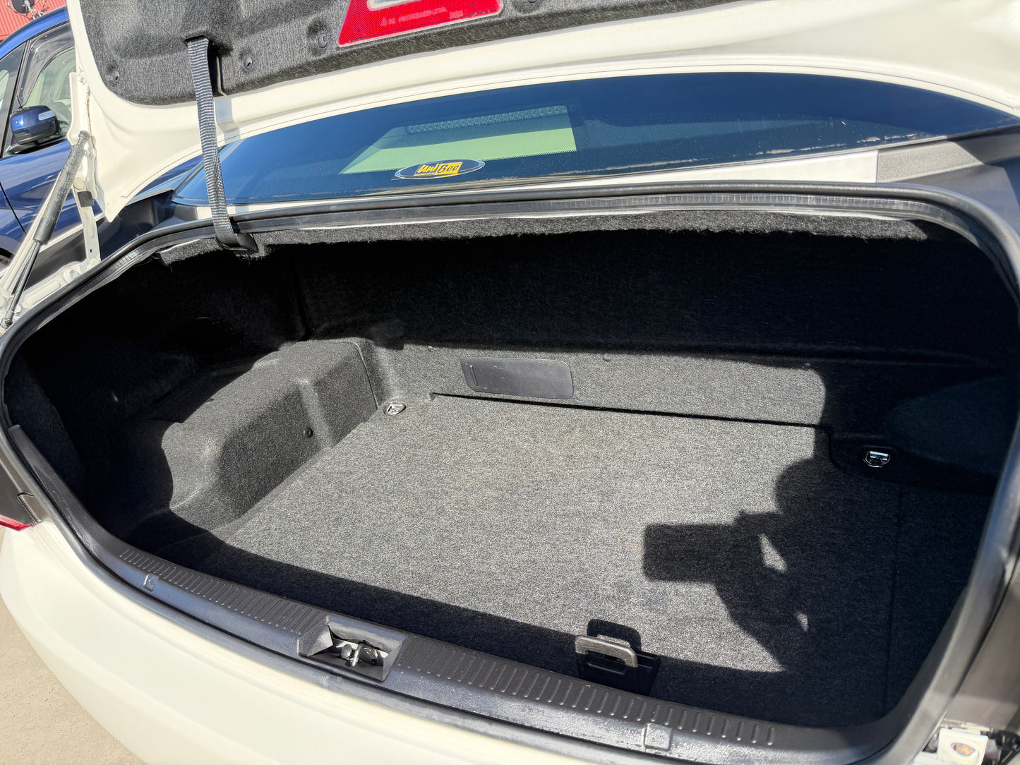 2012 Toyota Crown V6 3.5L Hybrid sedan trunk space showing spacious and clean interior.