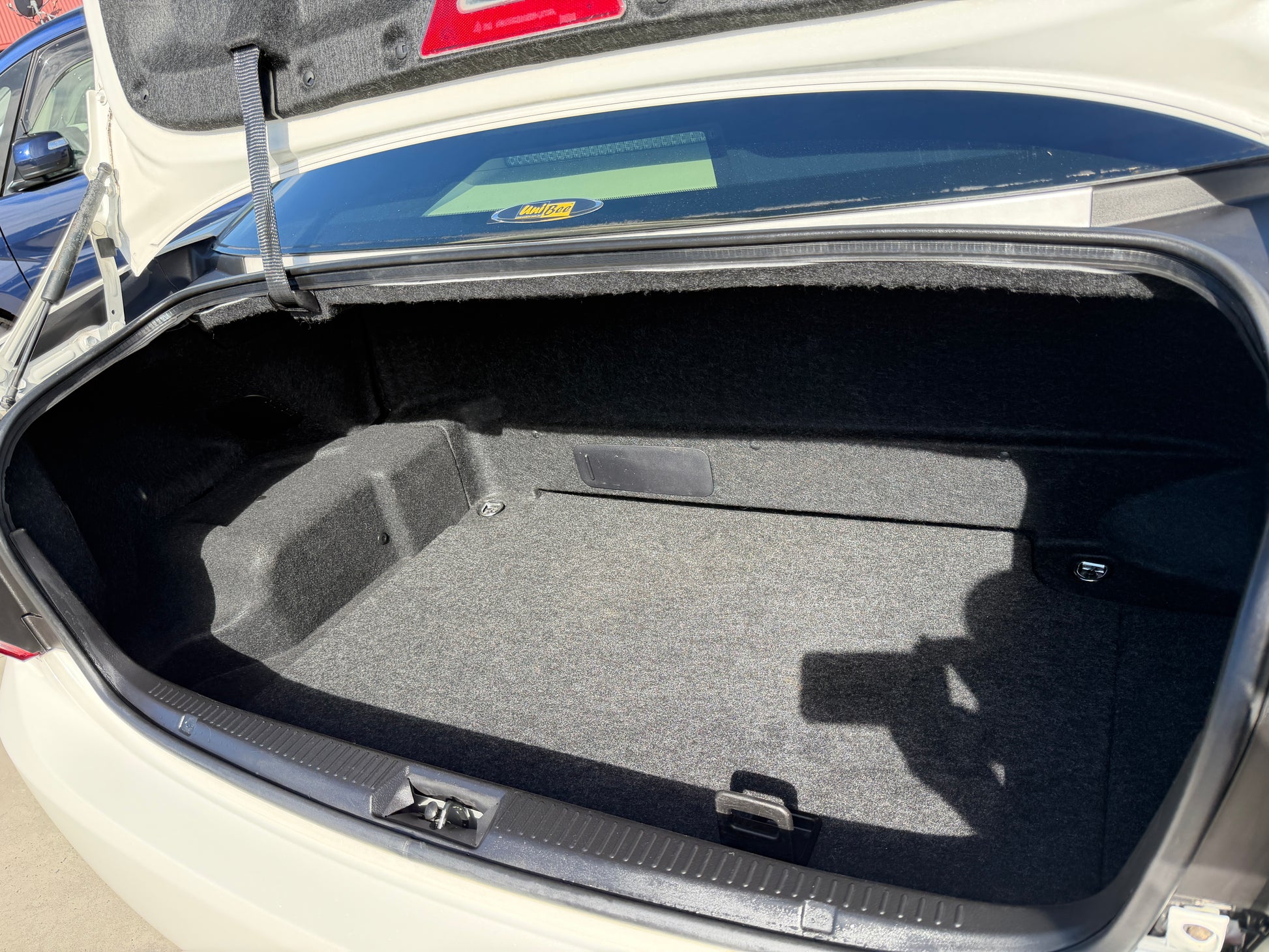 2012 Toyota Crown V6 3.5L Hybrid sedan trunk space showing spacious and clean interior.