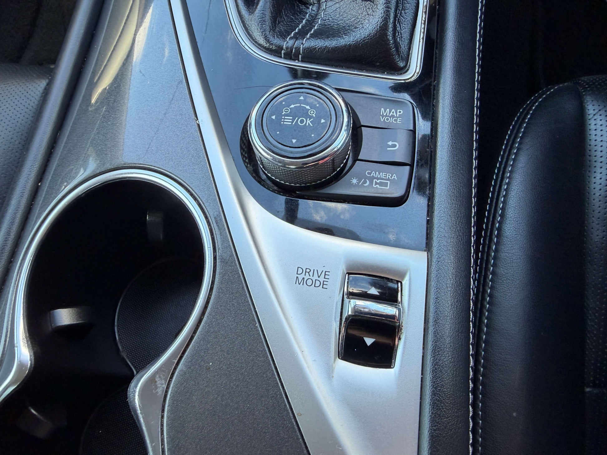 Interior controls of the 2014 Nissan Skyline V6 3.5L Hybrid 350GT Type P Version Sport with drive mode and camera buttons.