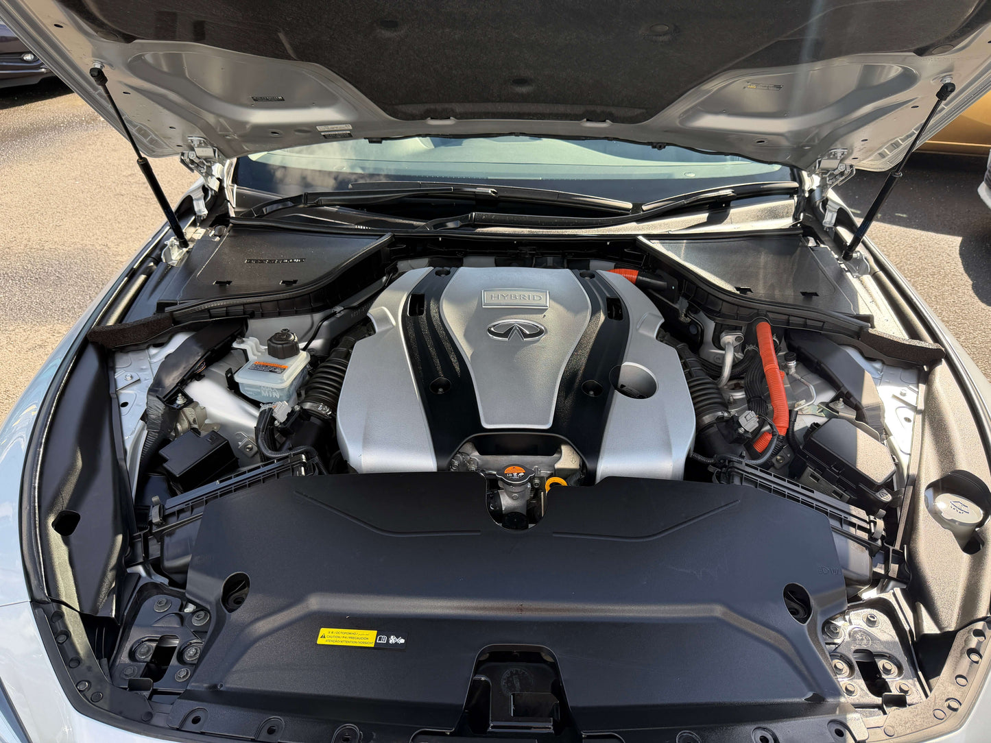 Engine bay of a 2014 Nissan Skyline V6 3.5L Hybrid showcasing performance components.