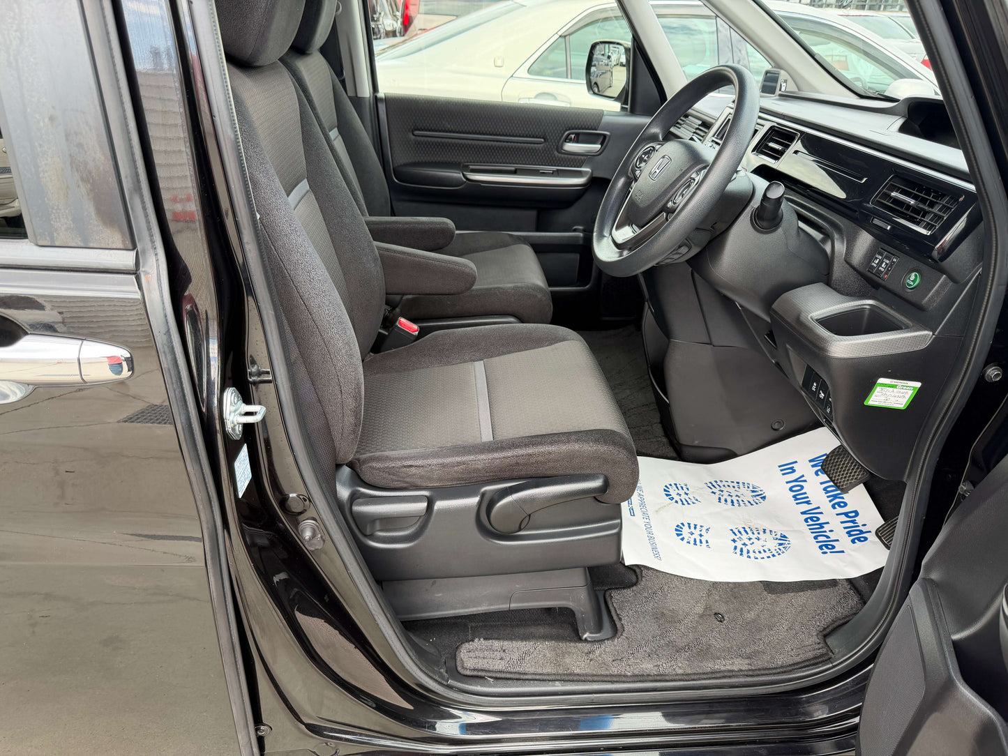 Interior view of the 2018 Honda Honda Stepwgn 2.0 Spada Hybrid showing front seating and dashboard.
