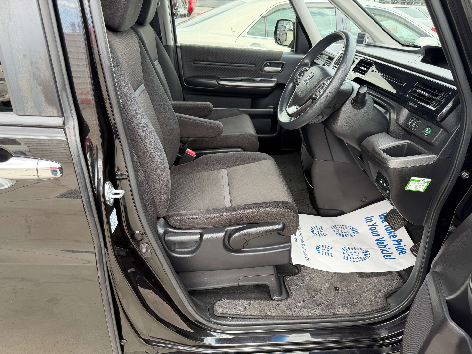 Interior view of the 2018 Honda Honda Stepwgn 2.0 Spada Hybrid showing front seating and dashboard.
