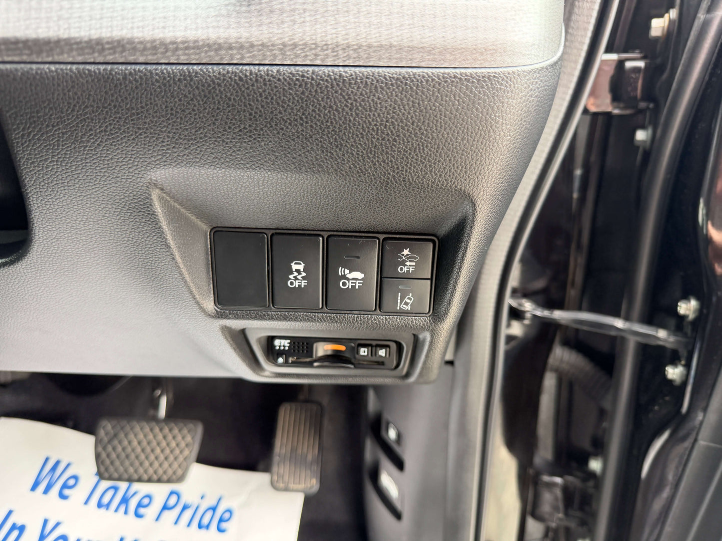 Interior controls of the 2018 Honda Honda Stepwgn 2.0 Spada Hybrid featuring various function buttons.