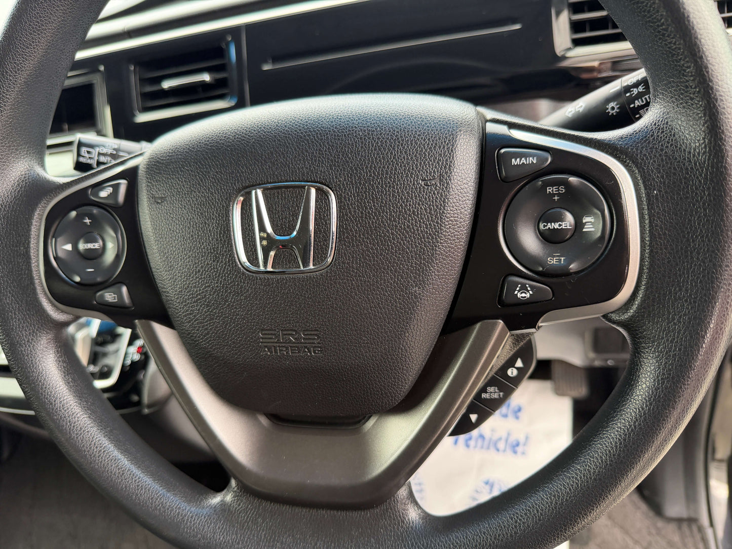 Interior view of the steering wheel of a 2018 Honda Honda Stepwgn 2.0 Spada Hybrid showing control buttons.