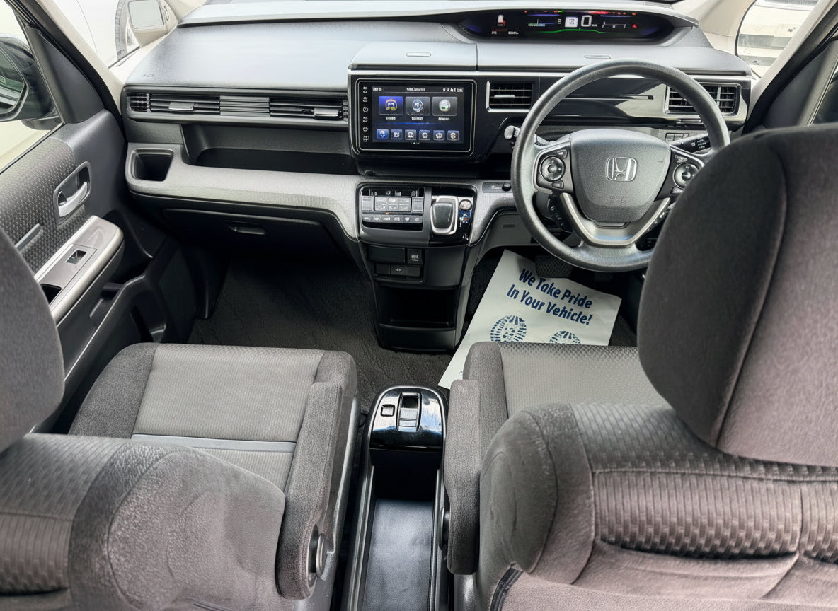 Interior view of 2018 Honda Honda Stepwgn 2.0 Spada Hybrid showing dashboard, steering wheel, and seating.