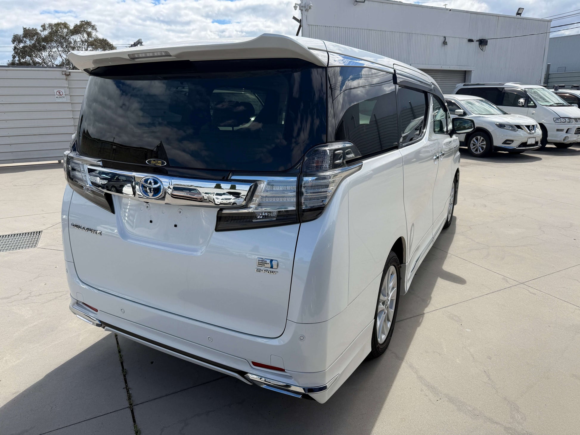 2015 Toyota Vellfire 2.5L e-Four Hybrid V-L Edition white luxury people mover rear view.