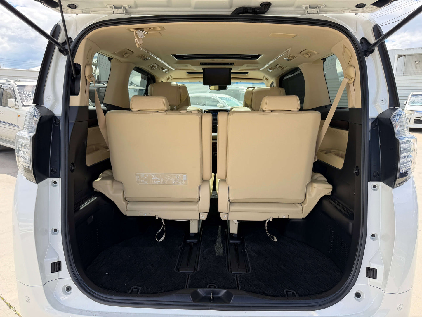 Interior view of the 2015 Toyota Vellfire 2.5L e-Four Hybrid, showing spacious 7-seater arrangement.