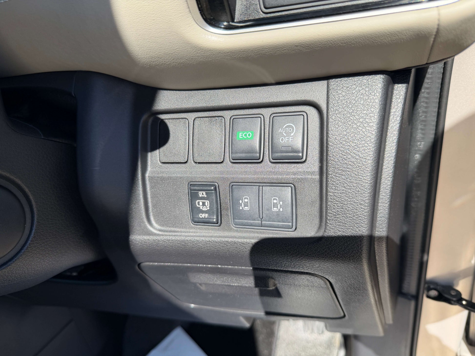 Controls for eco mode, traction control, and door locks in a 2017 Nissan Serena 2.0L S-Hybrid interior.