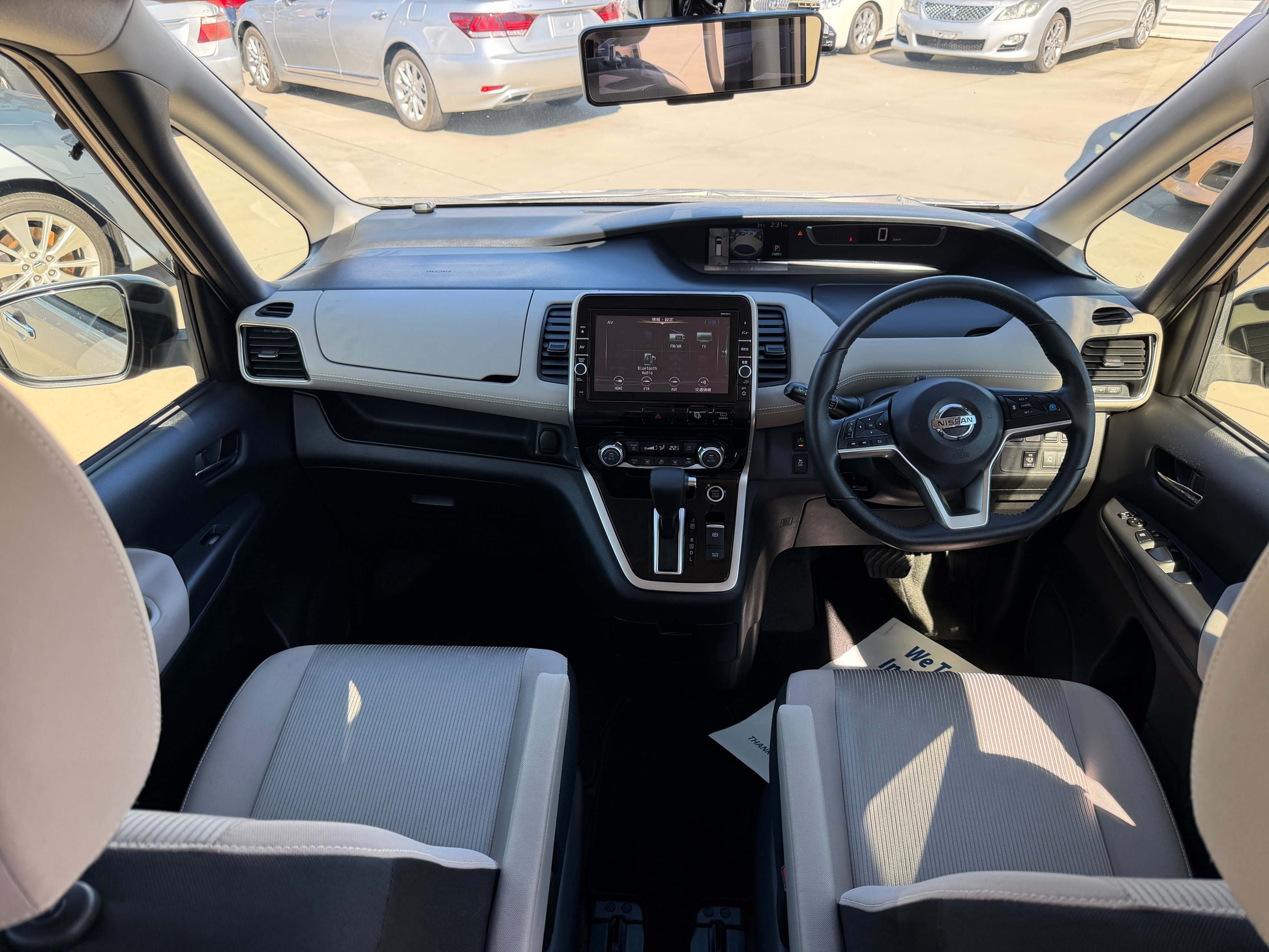 Interior view of a 2017 Nissan Serena 2.0L S-Hybrid with modern dashboard and seating for 8.