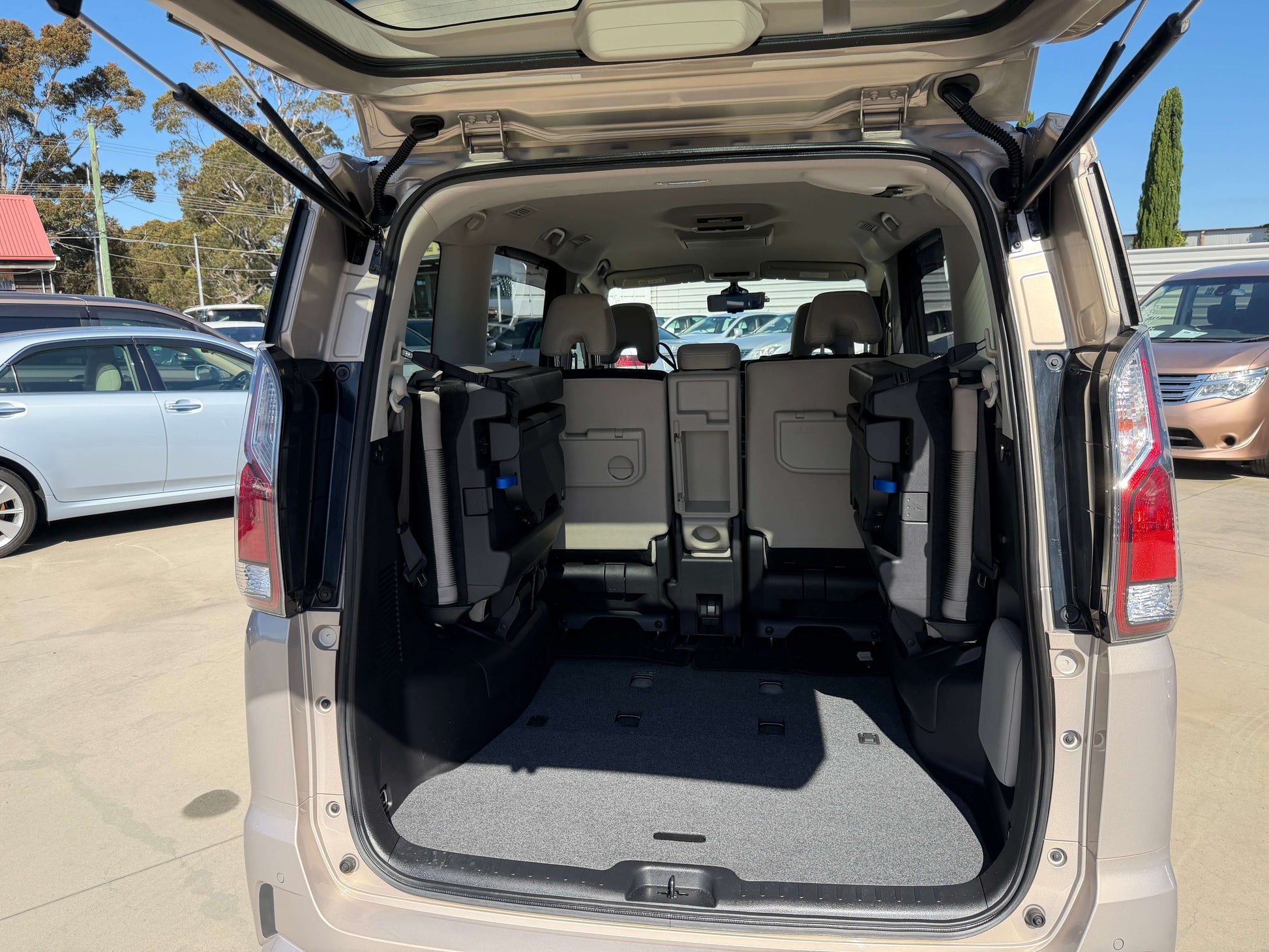 Interior view of the 2017 Nissan Serena 2.0L S-Hybrid with seats folded for cargo space.