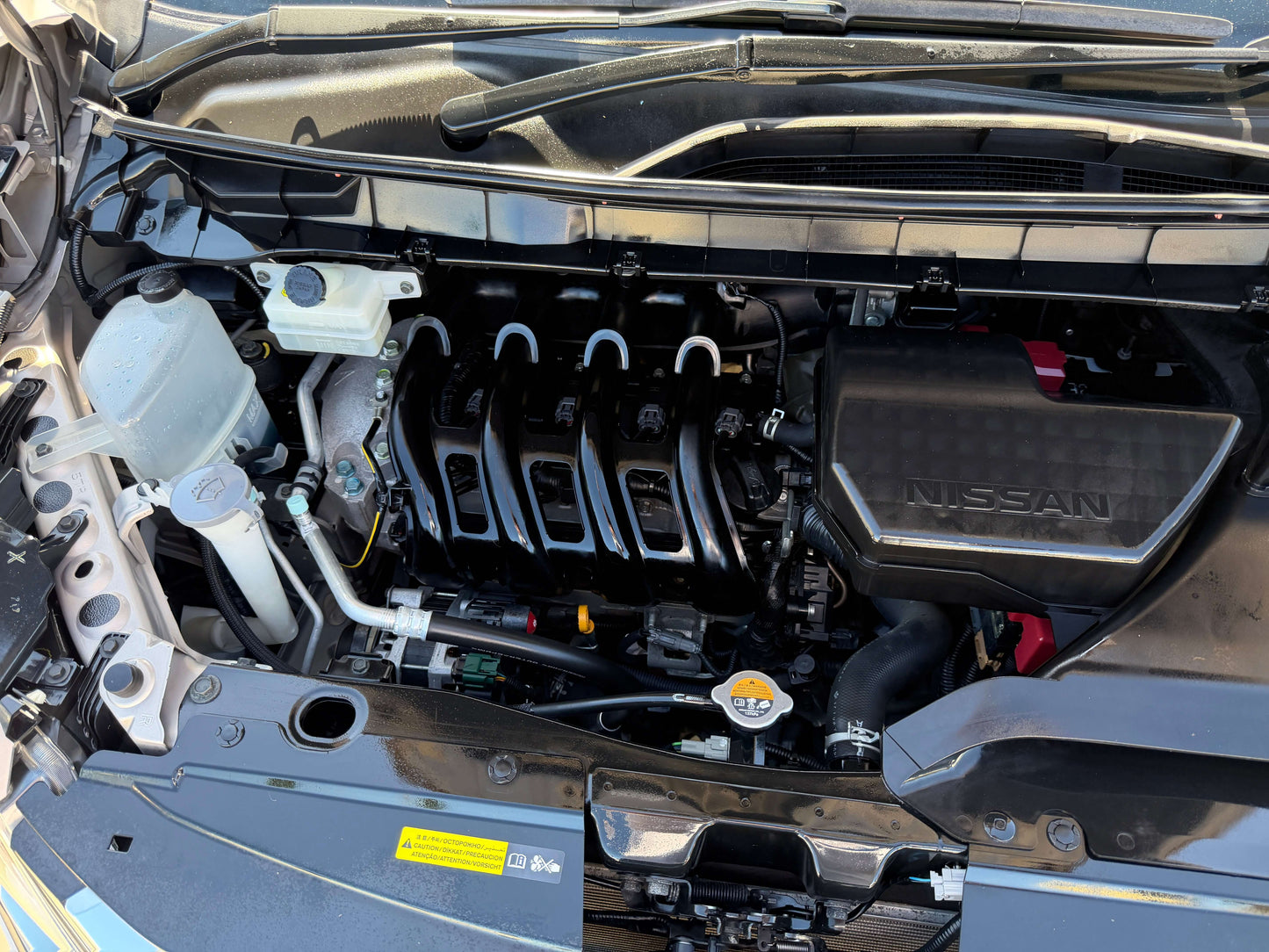 Engine compartment of a 2017 Nissan Serena 2.0L S-Hybrid showing the innovative features and technology.