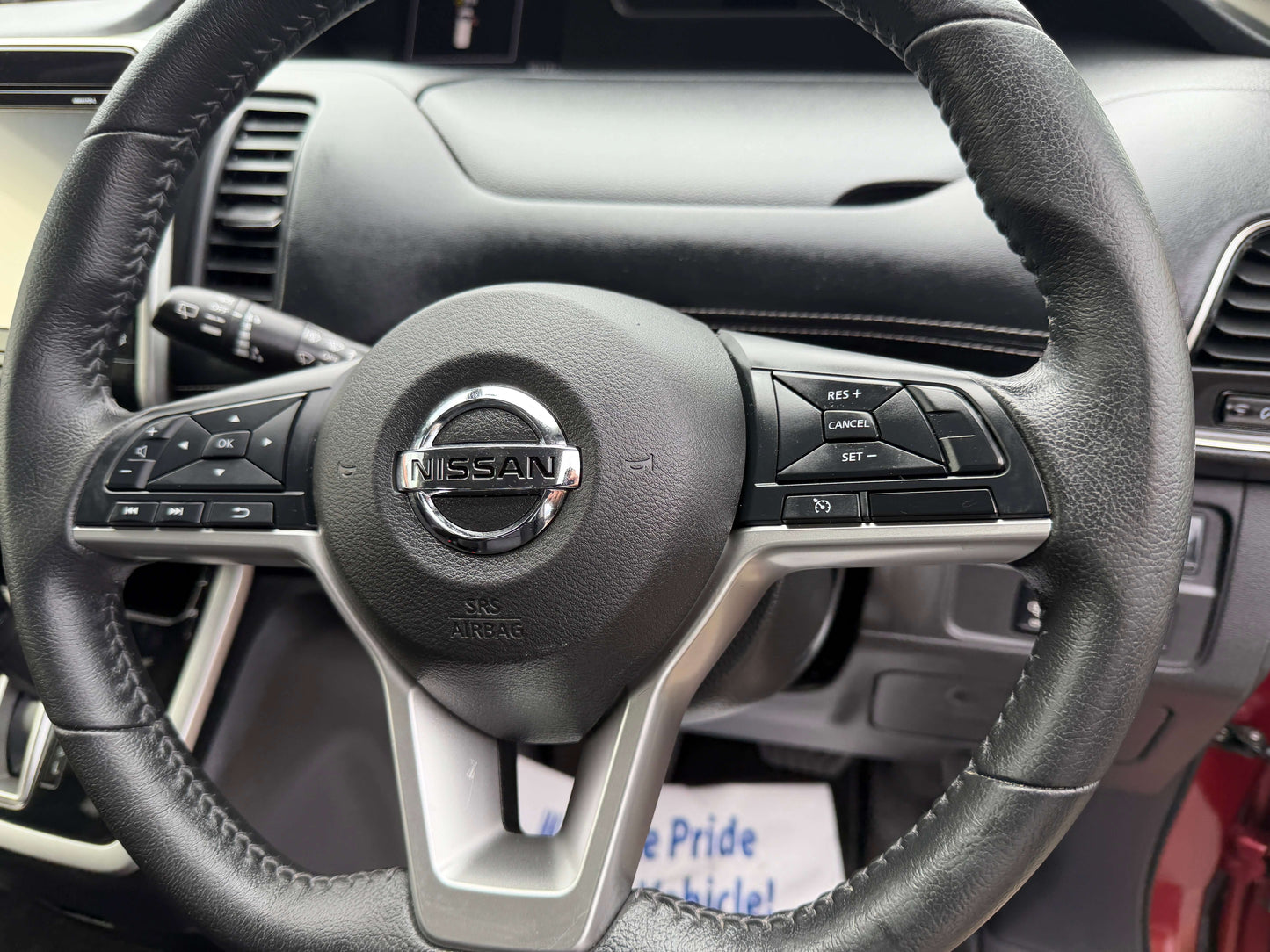 2018 Nissan Serena 2.0L S-Hybrid Highway Star steering wheel with controls and Nissan logo.