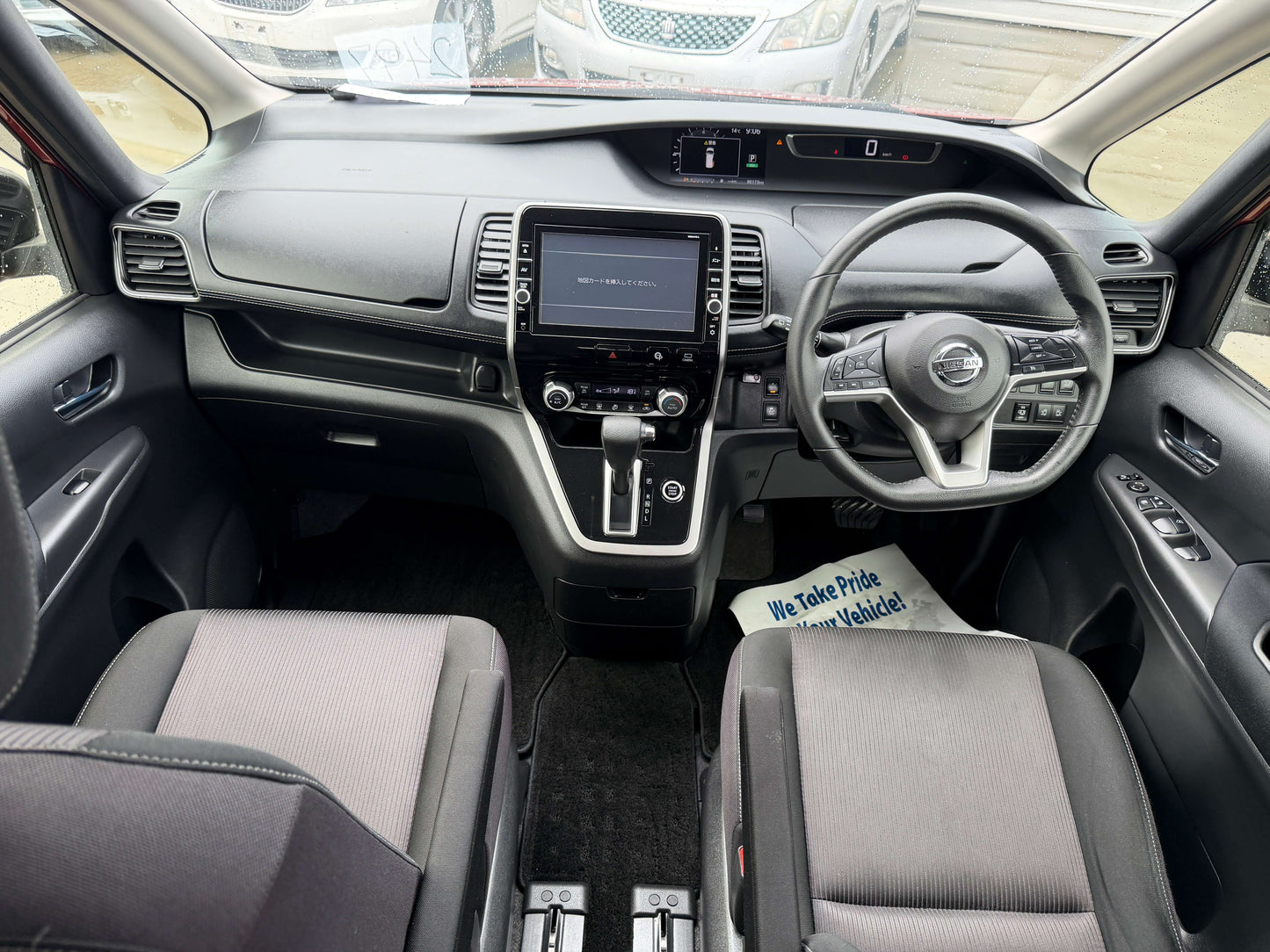 Interior view of 2018 Nissan Serena 2.0L S-Hybrid Highway Star showing dashboard and seating arrangement.