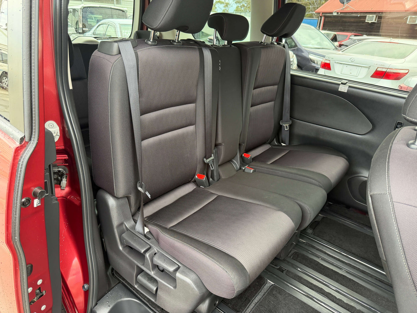 Interior view of the back seating area in a 2018 Nissan Serena 2.0L S-Hybrid Highway Star with 8 seats.