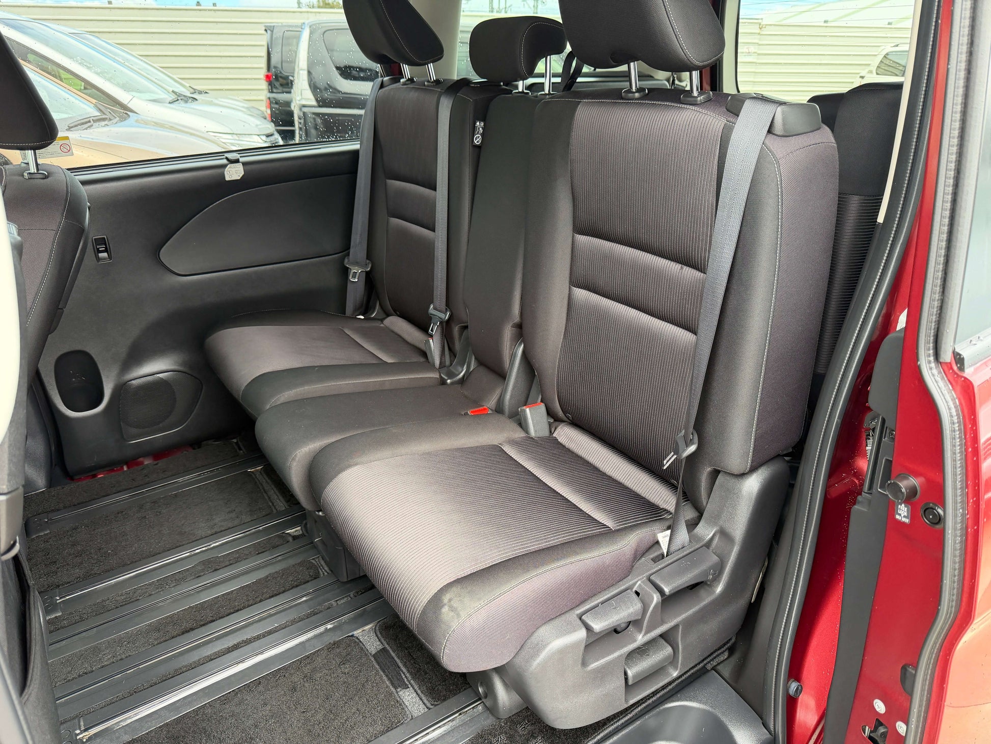 Interior view of the back seats in the 2018 Nissan Serena 2.0L S-Hybrid Highway Star, featuring 8 seats.